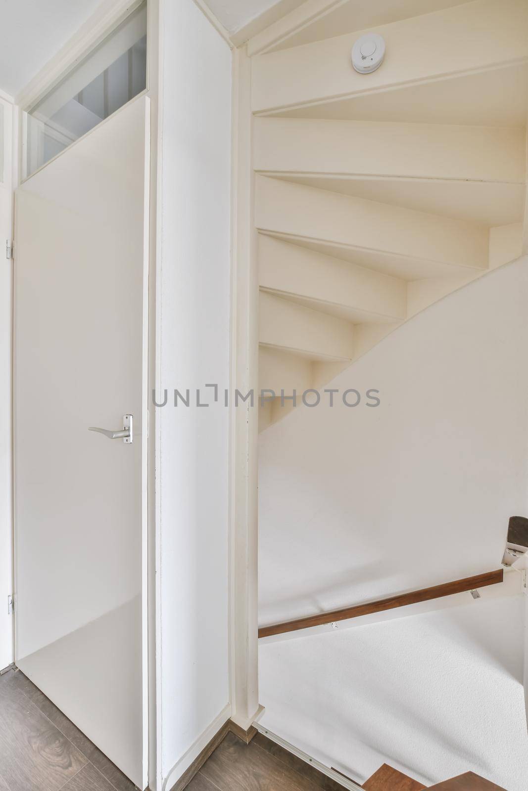 just a white staircase with a door
