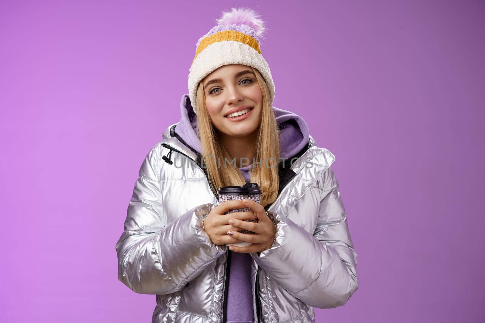 Tender relaxed cheerful smiling blond girl look pleased relieved drinking hot coffee cacao enjoying nice heartwarming moment look camera delighted gentle grin, wearing winter jacket hat by Benzoix