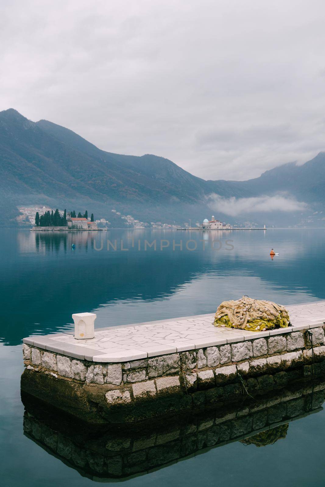 Pier overlooking the small islands in the Bay of Kotor. High quality photo