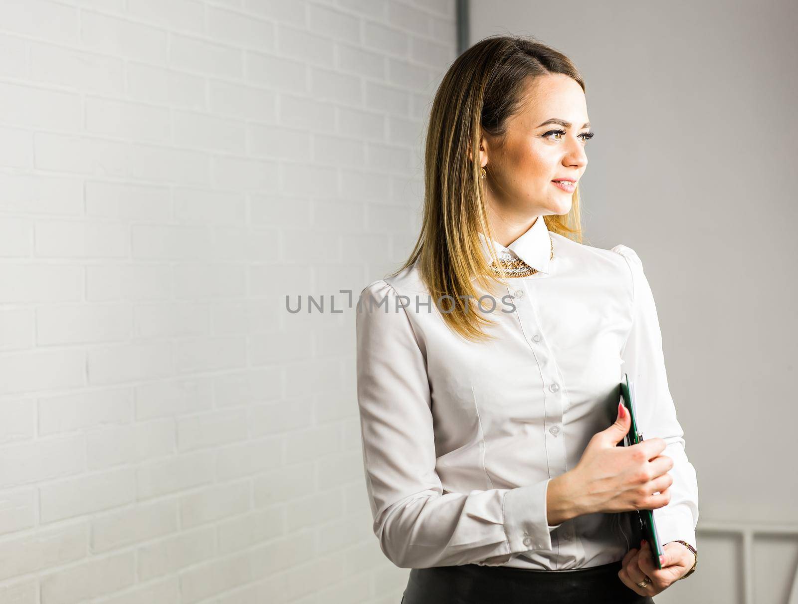 business woman hold a folder. Business woman working with documents in the office