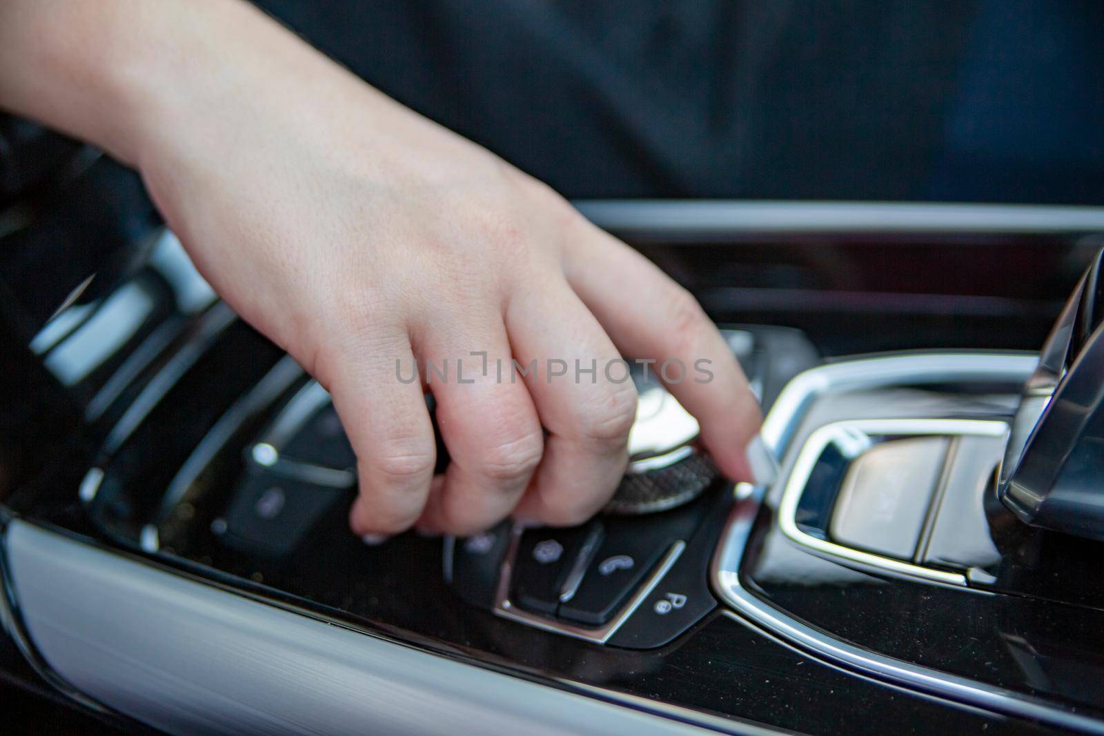 hand push ring button on center console of modern car by Mariaprovector