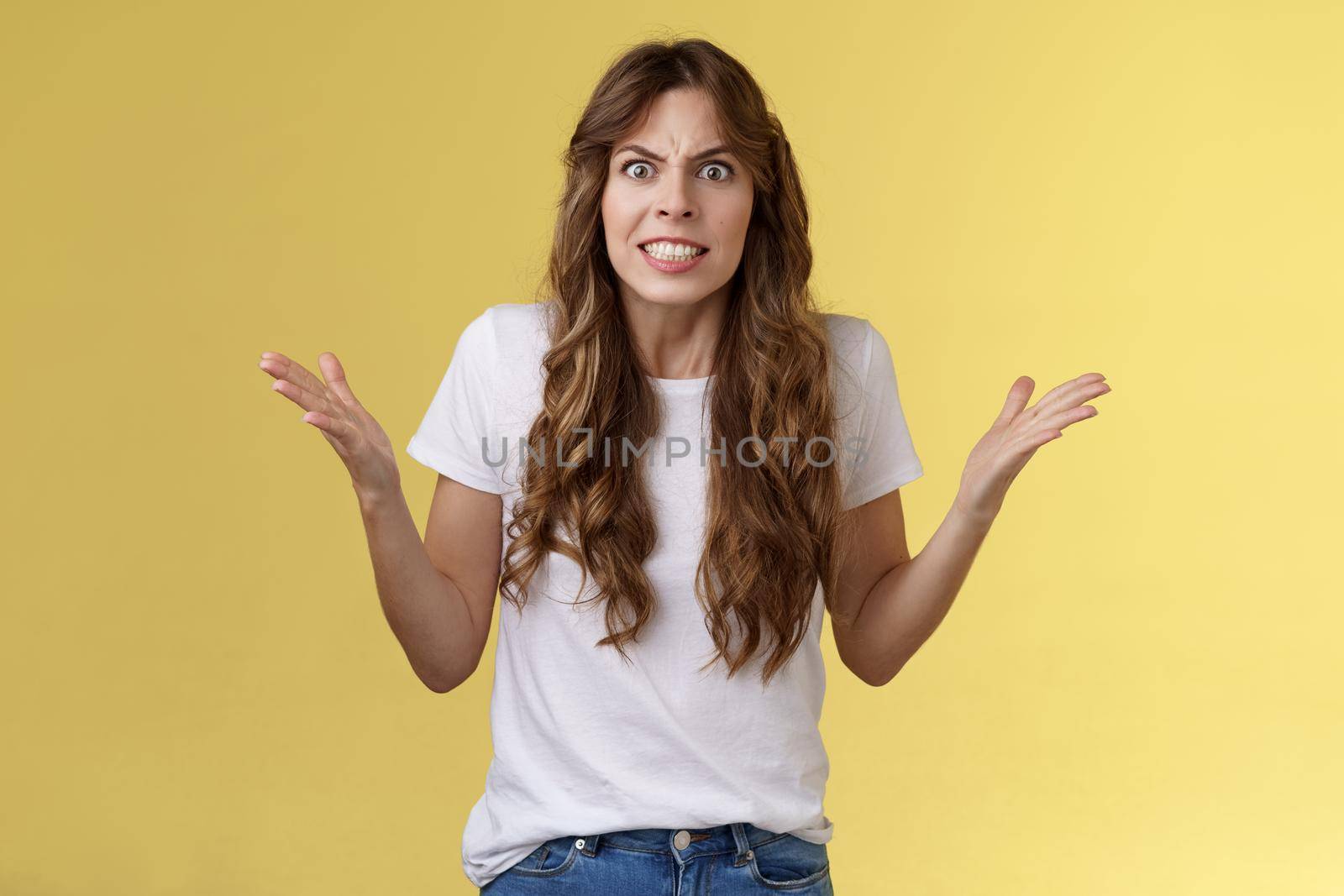 Intense pressured scary woman arguing pissed shaking hands dismay outraged frowning grimacing stare camera furious release anger complaining having fight fed up stupid boyfriend actions.