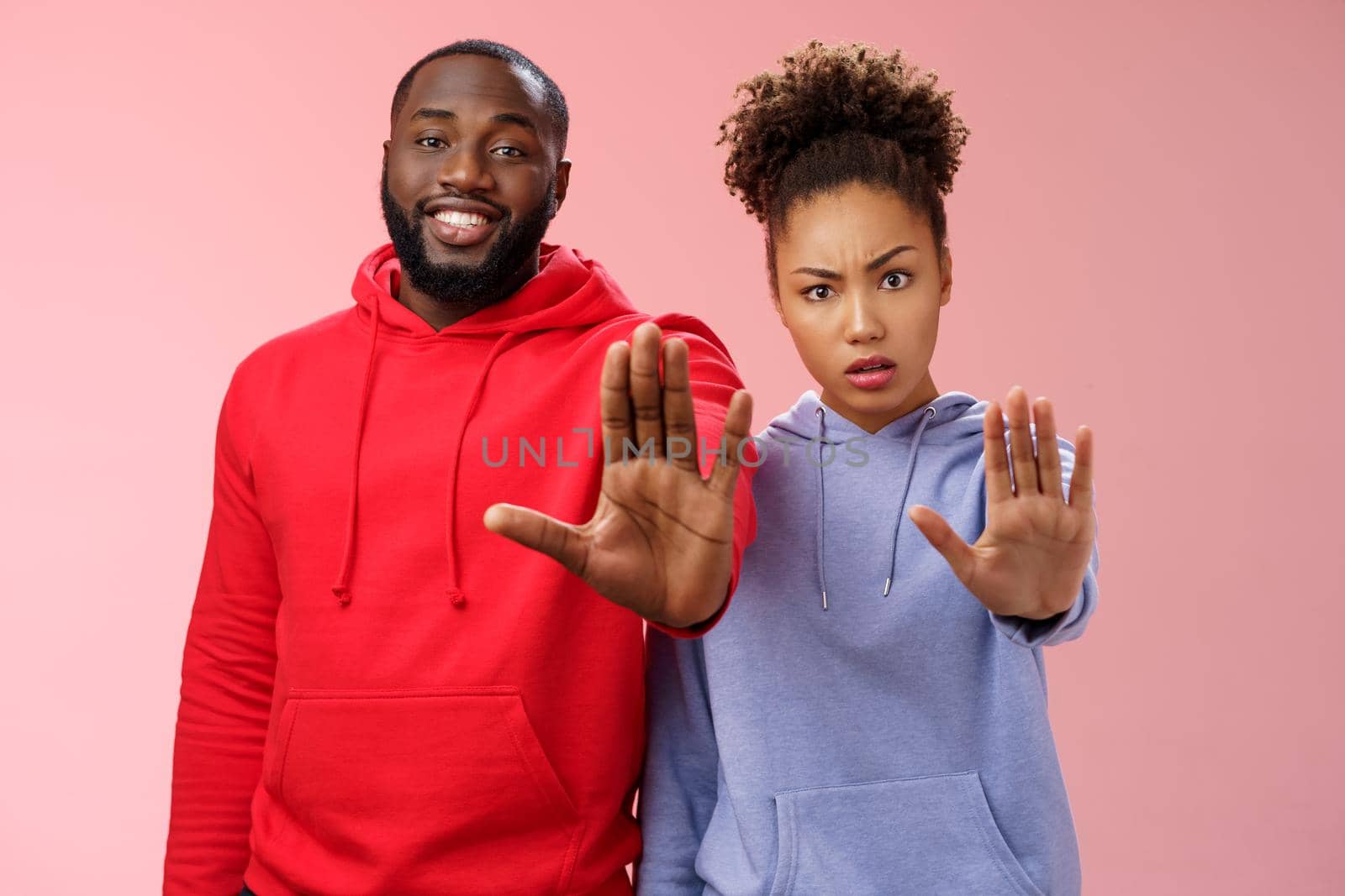 Friend asking stop worrying health raise palm forbidden enough dangerous gesture. Two african american man woman show hand prohibition taboo gesture persuading quit smoking, pink background by Benzoix