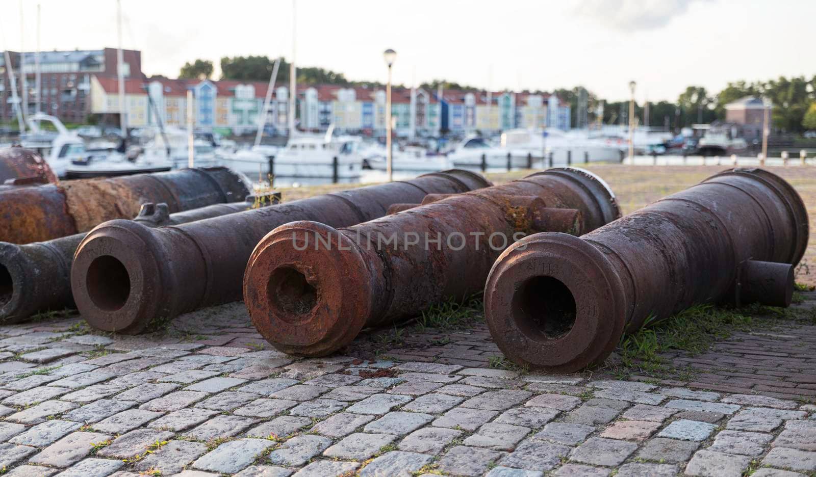 Old Rusty Canons By River At Promenade in Hellevoetlsuis