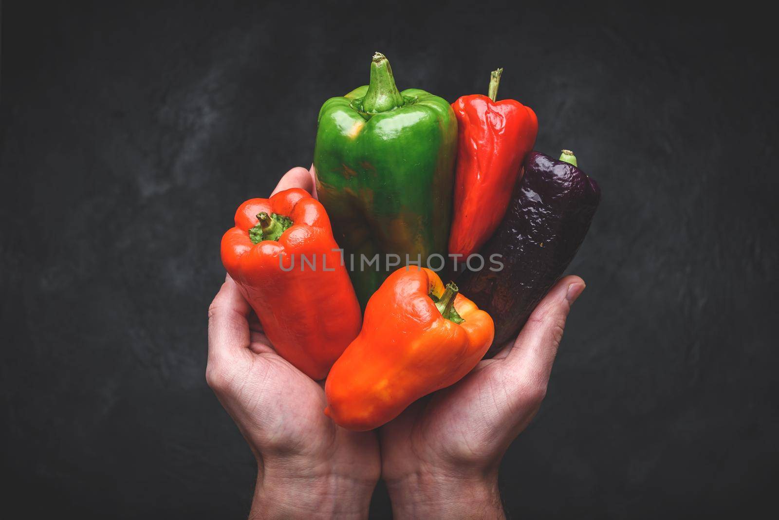 Hands with different bell peppers by Seva_blsv