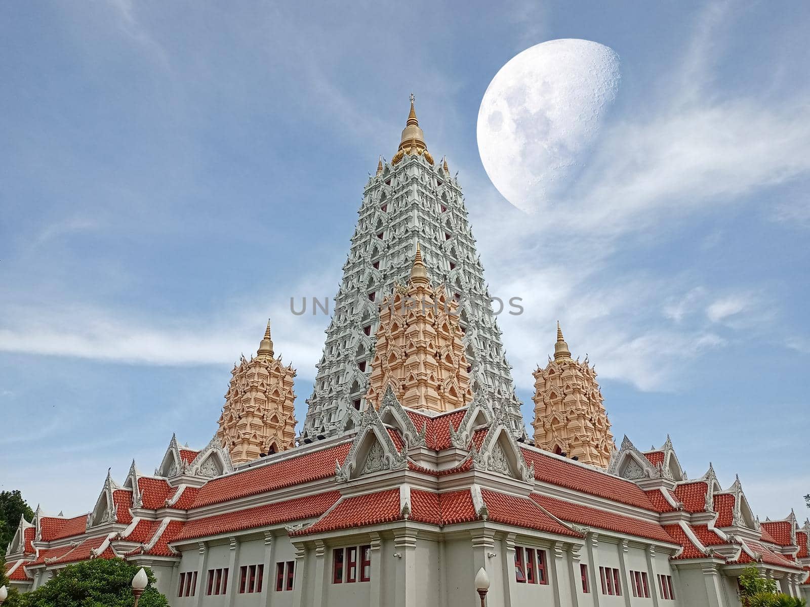 half moon over Buddhagaya pagoda and heap white cloud on sky, Elements of this image furnished by NASA