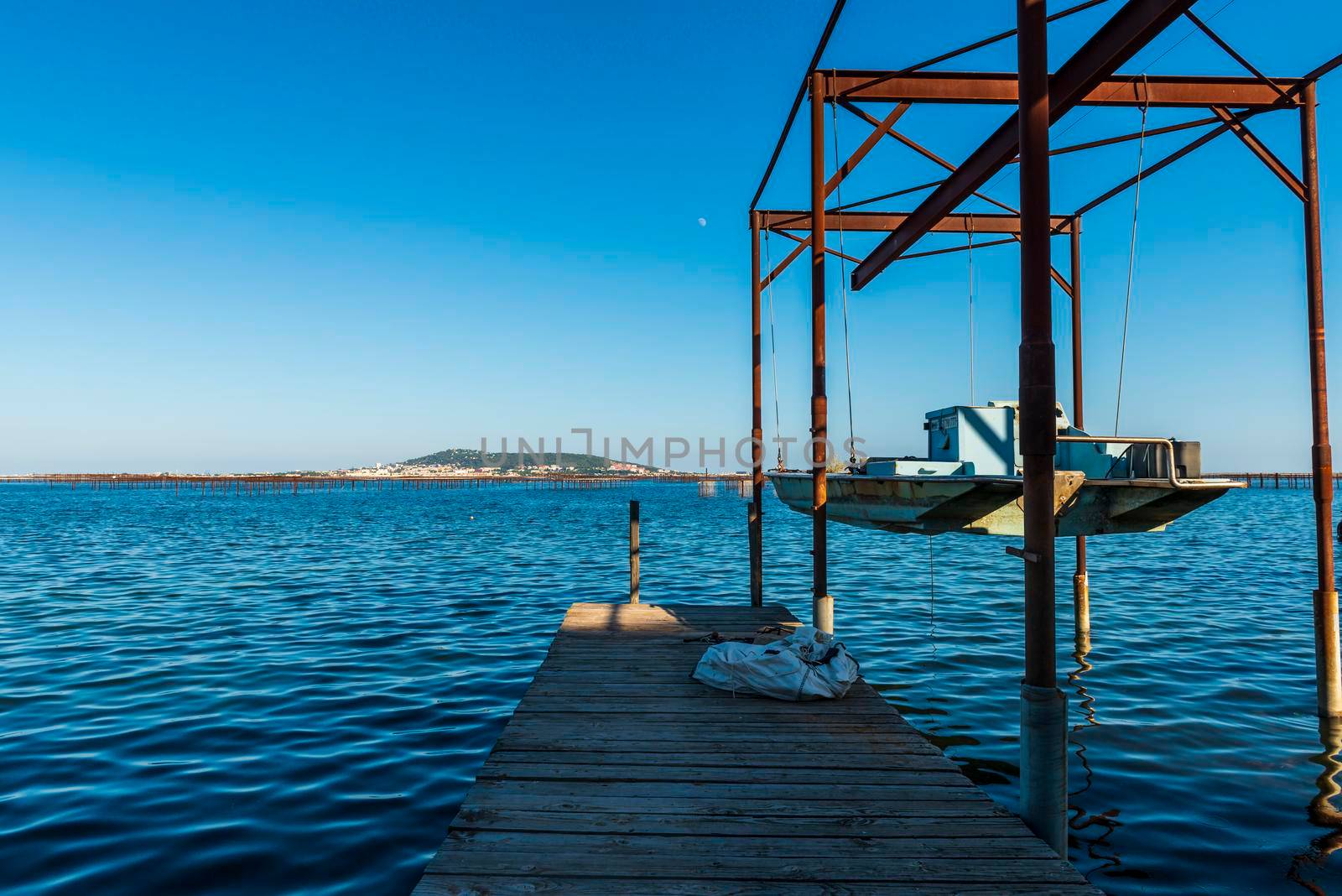 Oyster farm on the Thau lagoon and Mont Saint Clair in the background, in Bouzigues, Occitanie, France by Frederic