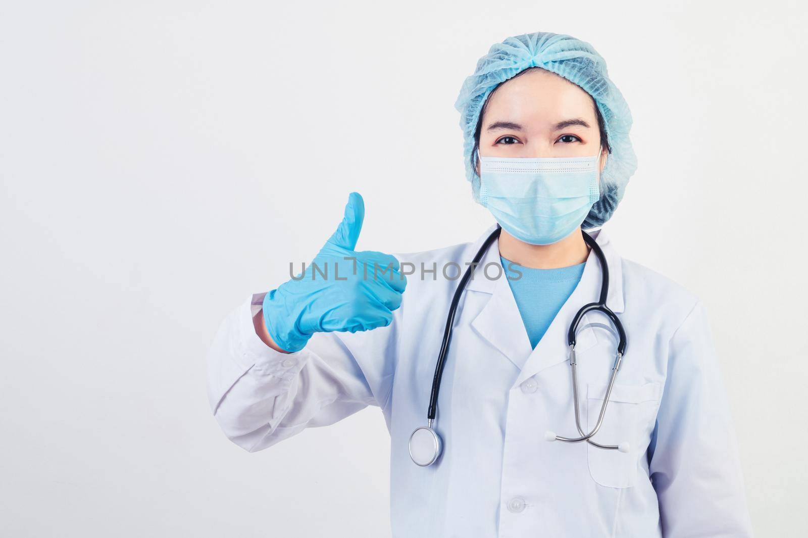 Professional doctors give big thumbs up gesture on white background to patients who treated at hospital or clinic to assure will get well soon. Medical personnel and health people concept. Copy space by MiniStocker