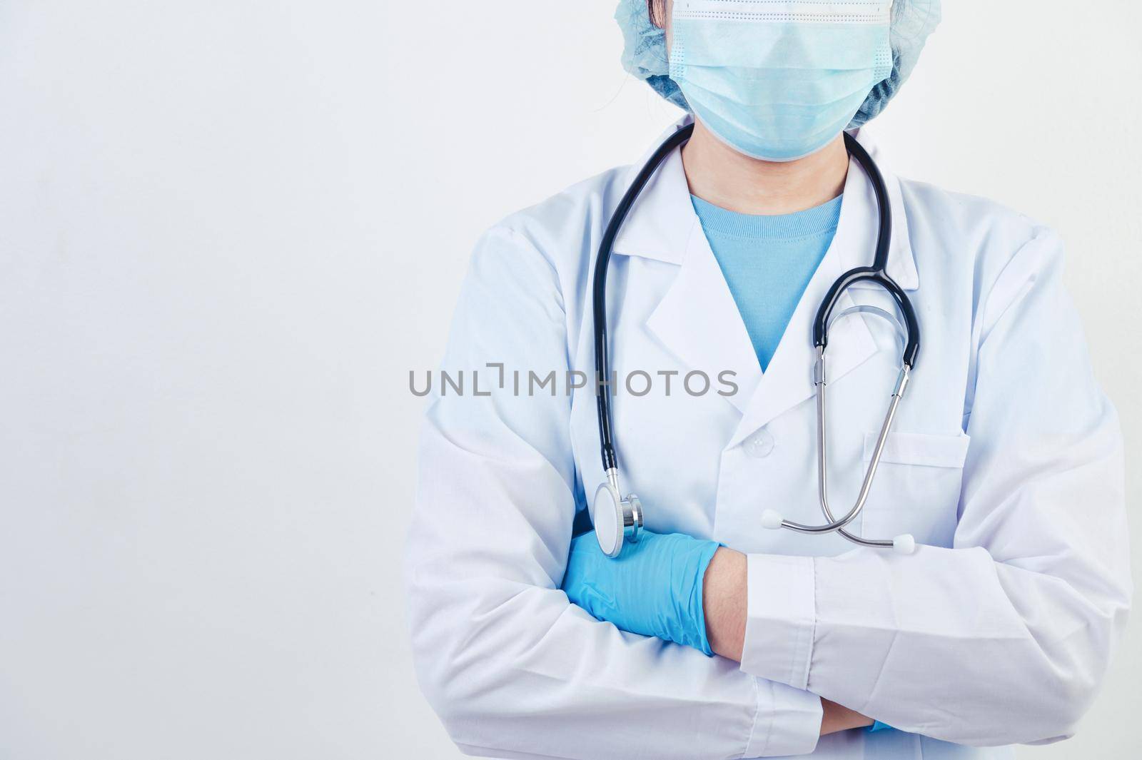 Professional doctor doing arms crossed gesture for build confidence in patients on white background. Medical personnel and Health people concept. Copy space