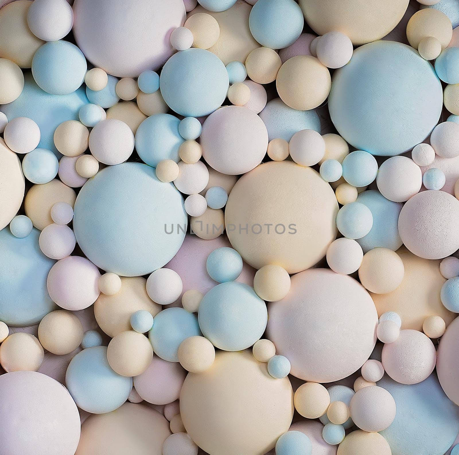 Abstract 3d background with pastel colors matte balls. delicate blue, pink, beige balls different sizes of spherical shape. texture background. Close-up. High quality photo