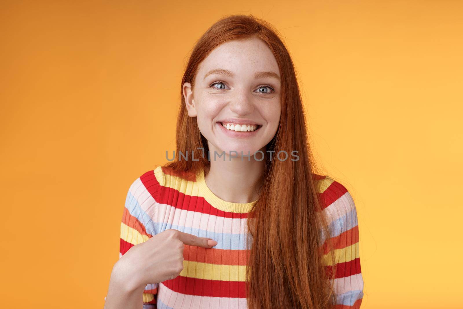 Happy excited grinning redhead girl chosen smiling gratitude delighted gladly pointing herself look surprise thankful camera got job, receive scholarship standing orange background by Benzoix