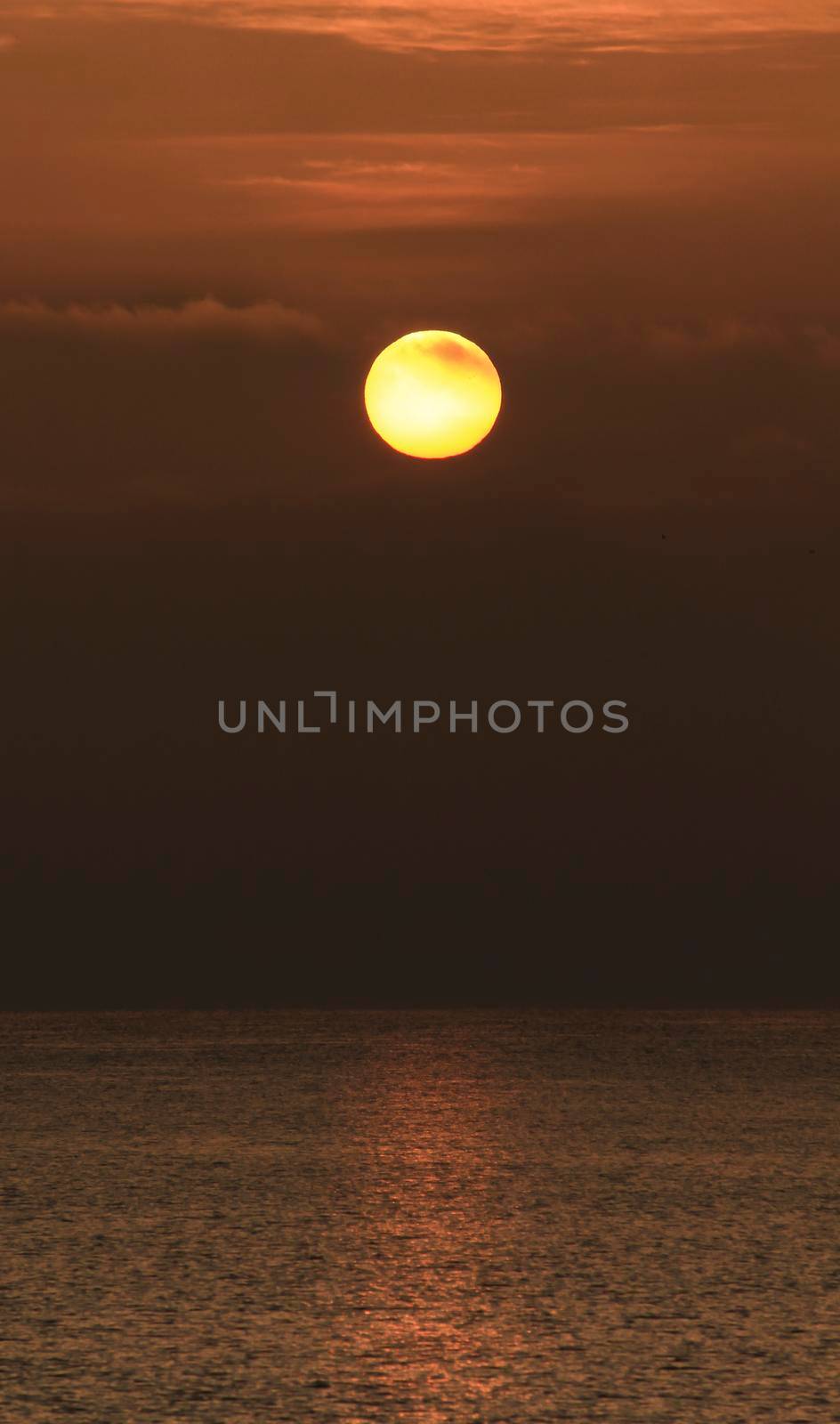 Colorful sun at sunrise over the mediterranean sea in southern Spain in Winter