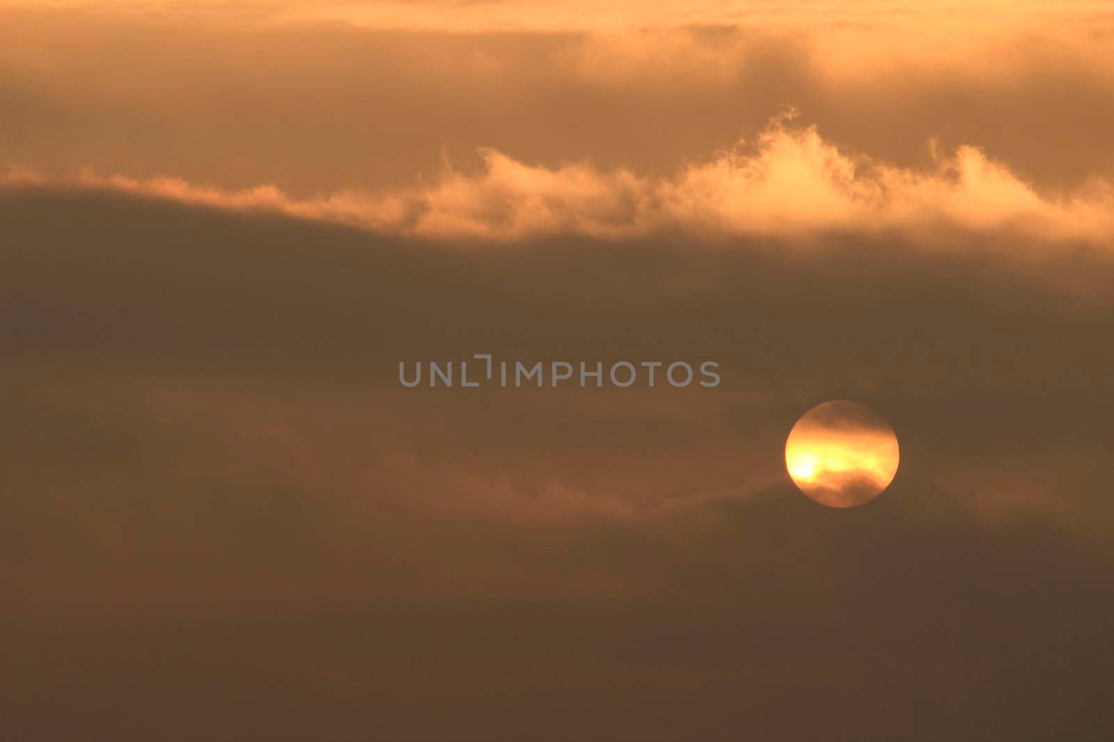 Colorful sun at sunrise over the mediterranean sea in southern Spain in Winter