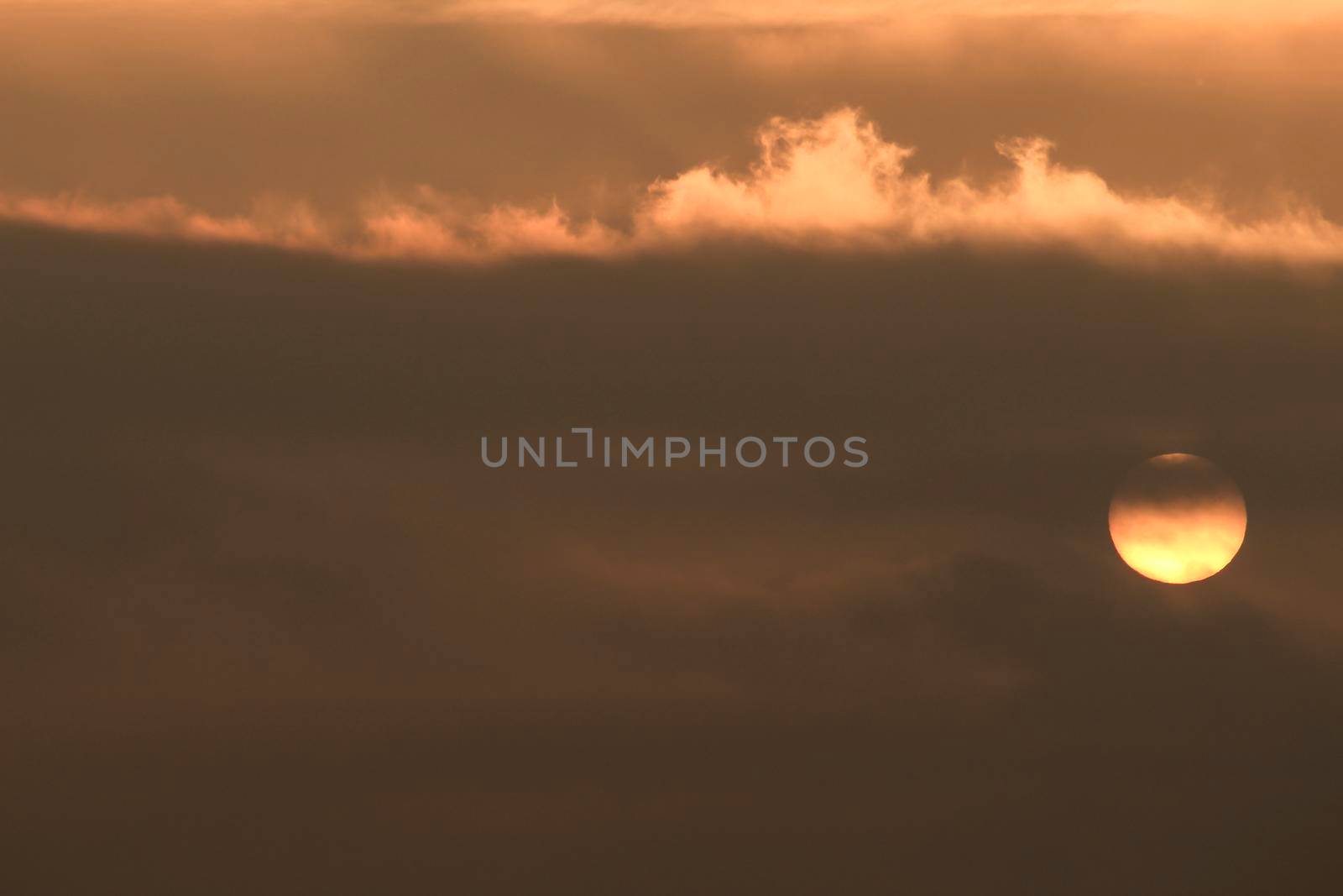 Colorful sun at sunrise over the mediterranean sea in southern Spain in Winter