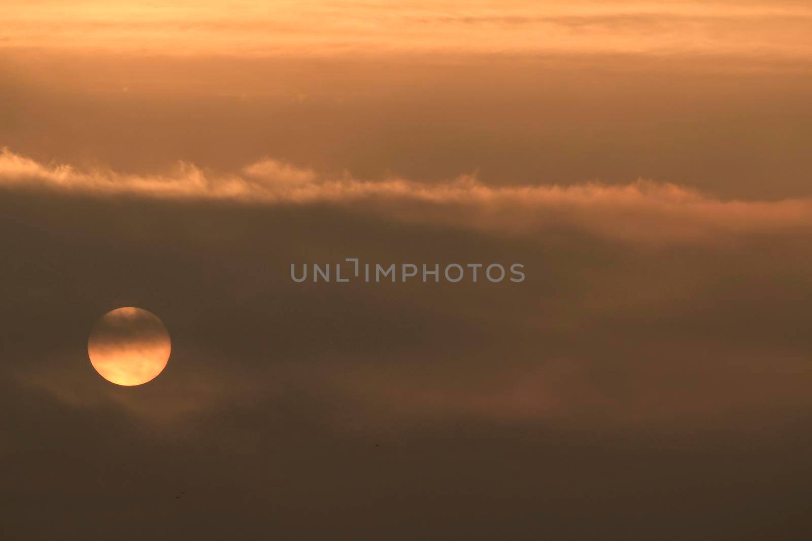 Colorful sun at sunrise over the mediterranean sea in southern Spain in Winter