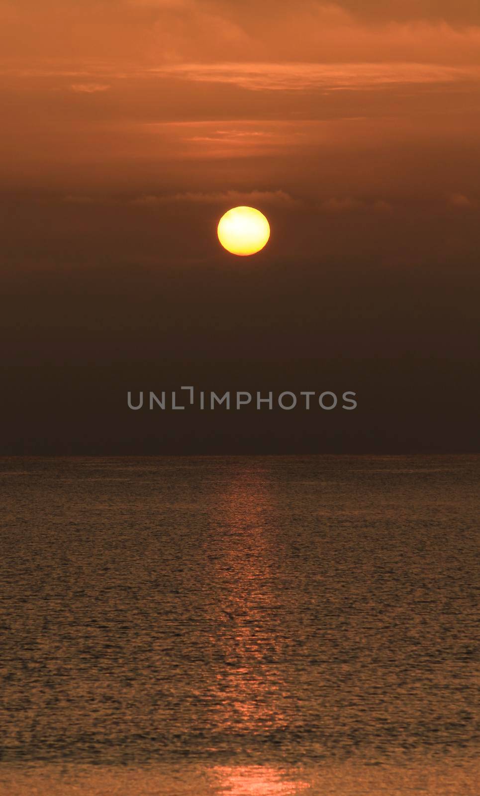 Colorful sun at sunrise over the mediterranean sea in southern Spain in Winter