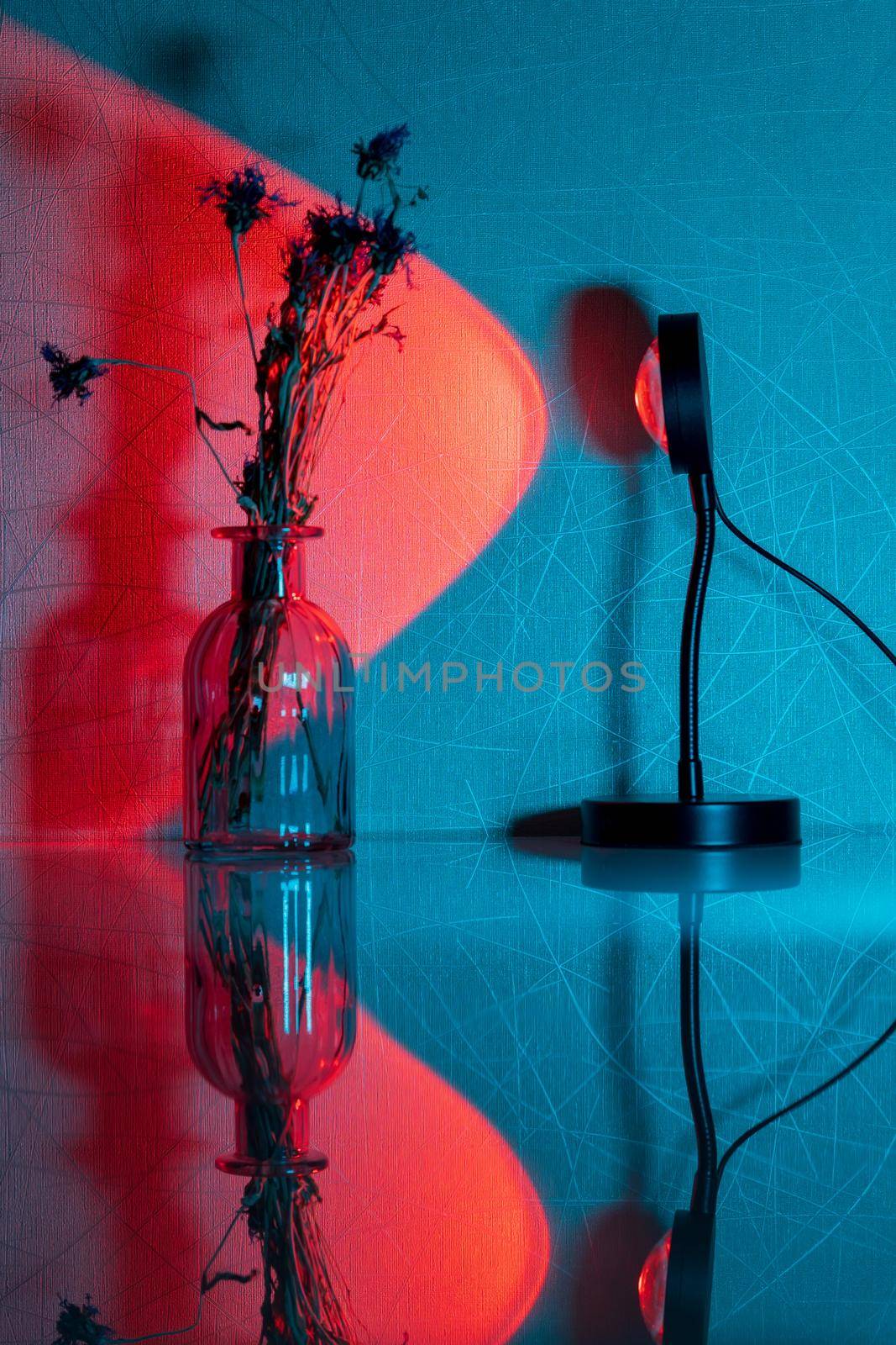 Sunset projector lamp on the table. Multi colored RGB light. Home decor. Selective focus