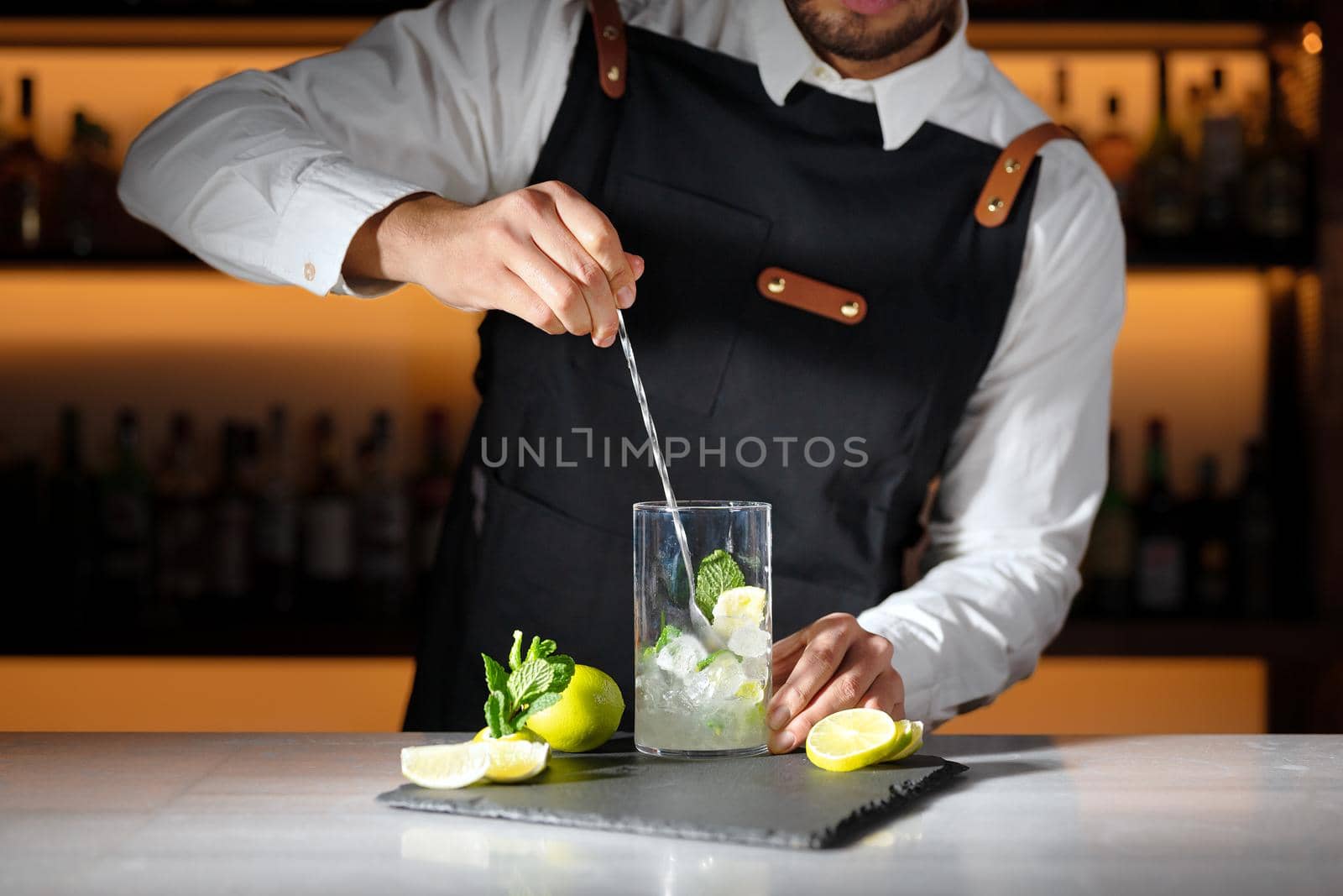 Barman preparing mojito cocktail. High quality photography by HERRAEZ