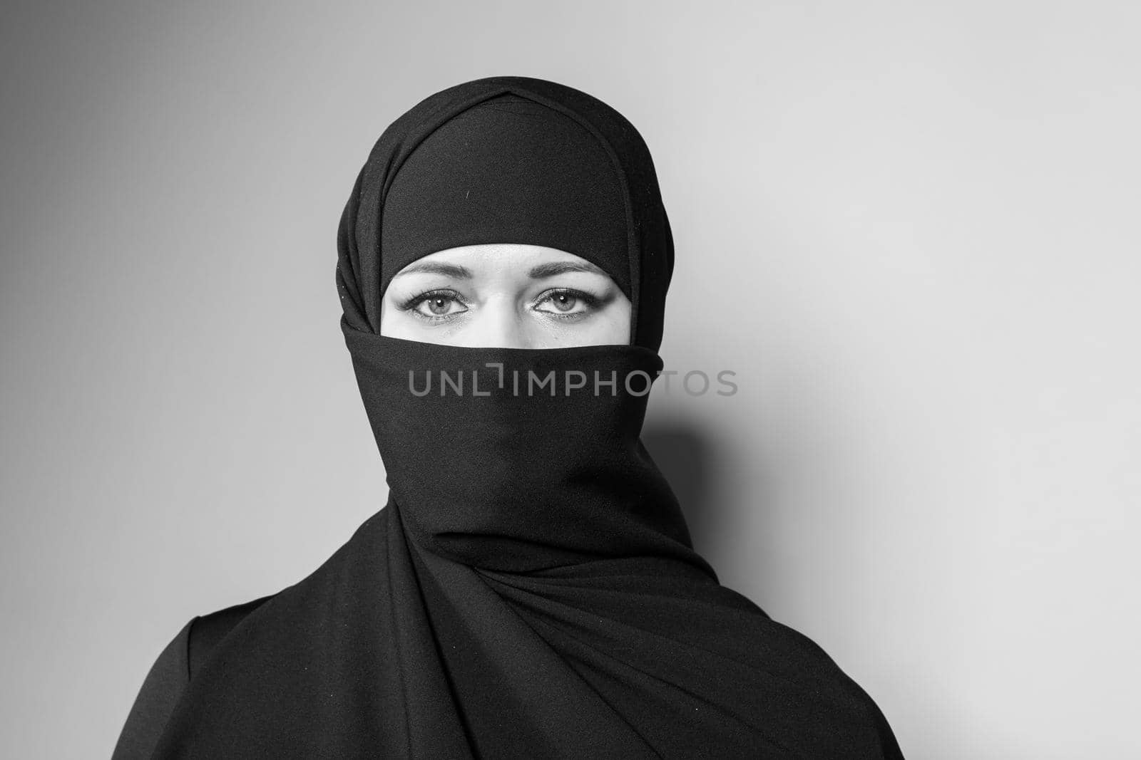 Beautiful girl with a scarf and black veil.