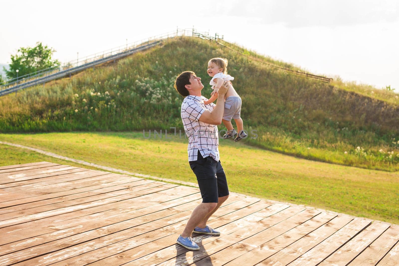 Father and son in the countryside on a sunny day.