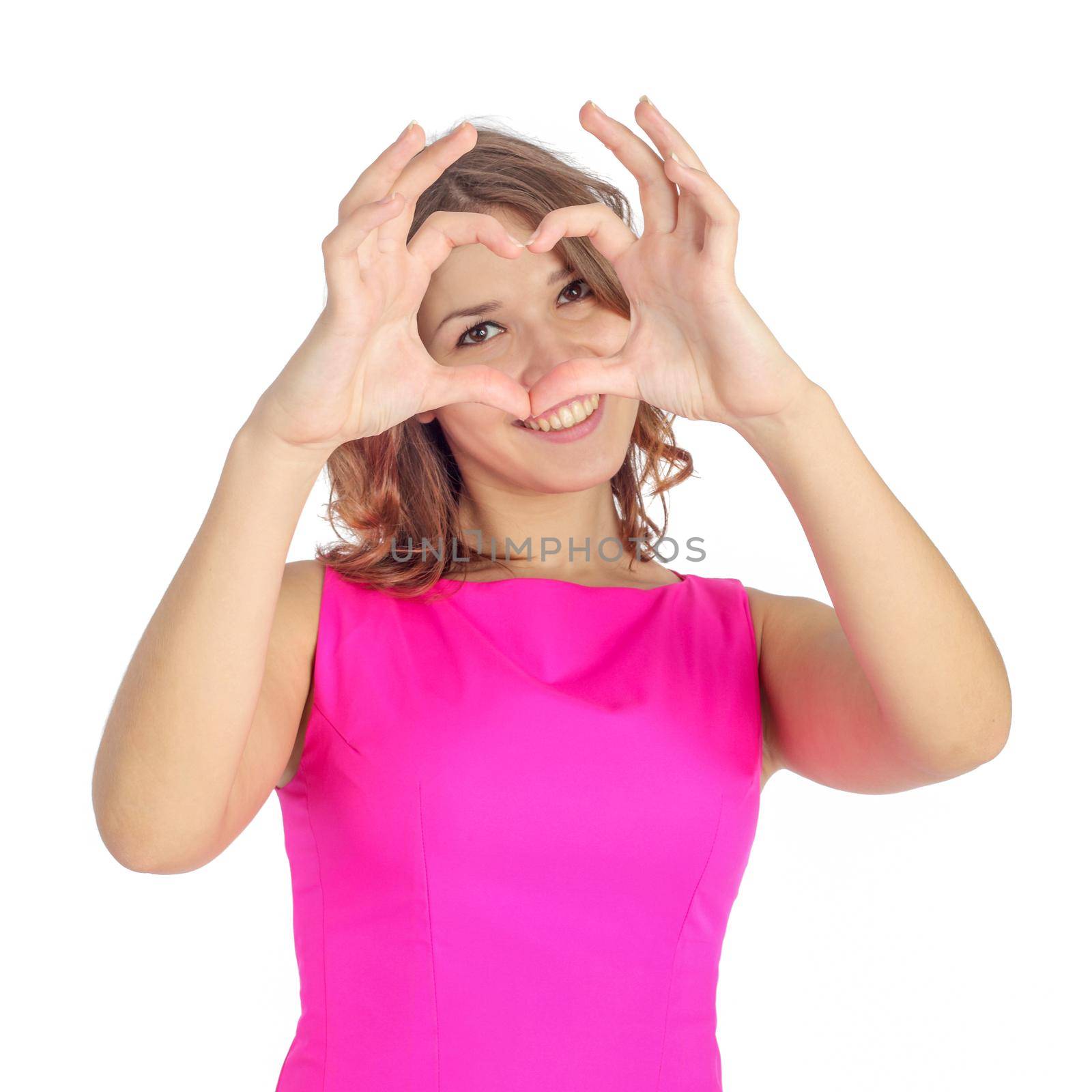 pretty young girl making a heart symbol with her hands, focus on the hands