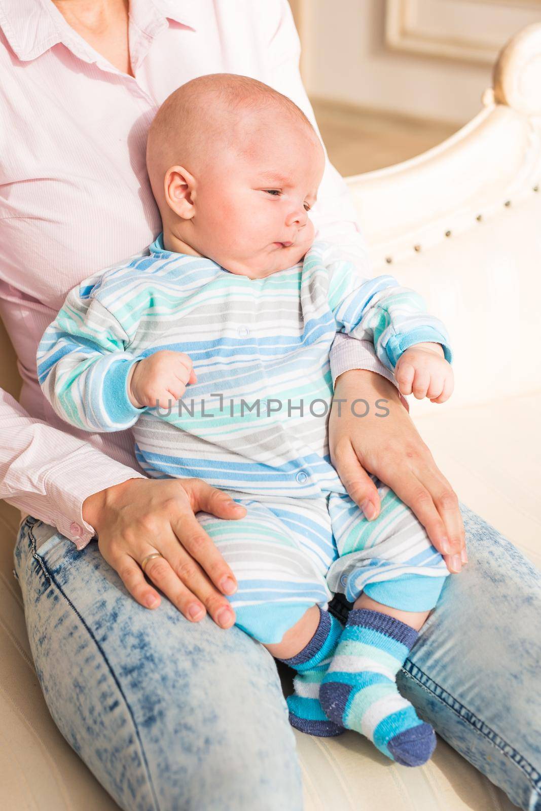 A portrait of a cute newborn baby laughing