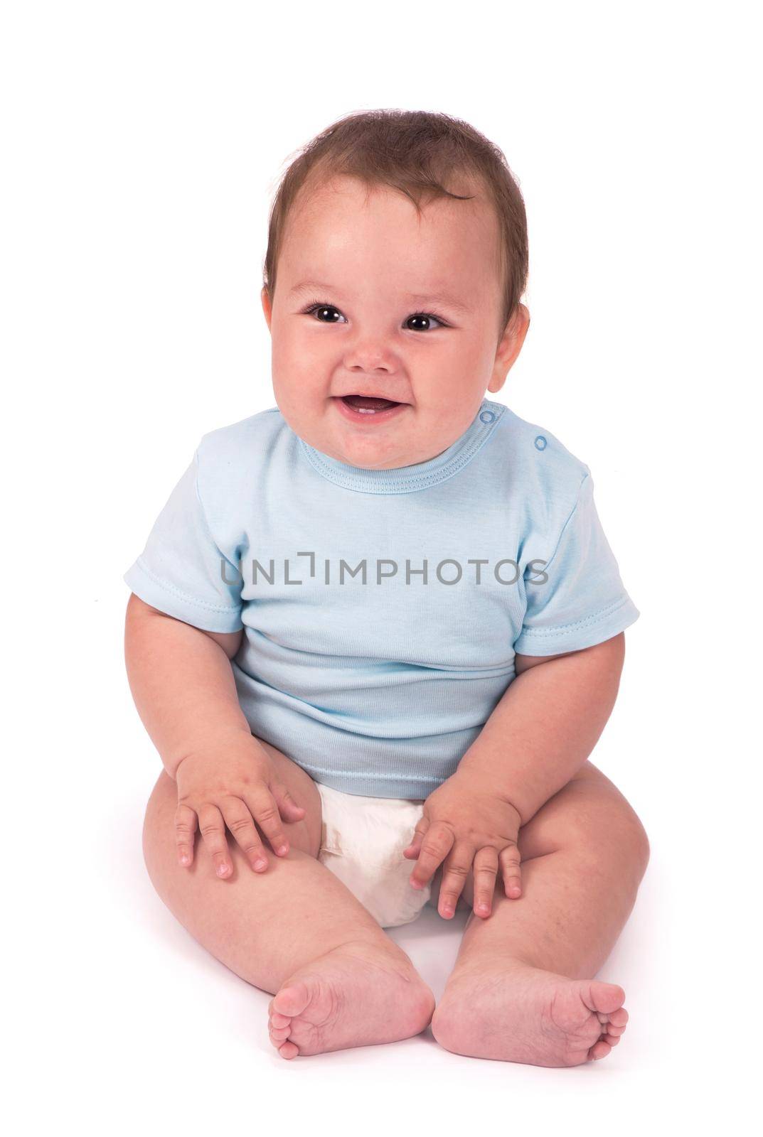 Little baby boy lying on the bed on white background by aprilphoto