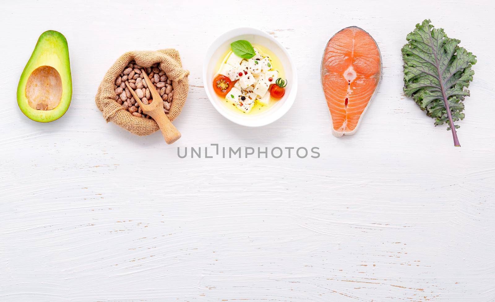 Ketogenic low carbs diet concept. Ingredients for healthy foods selection set up on white concrete background.  by kerdkanno