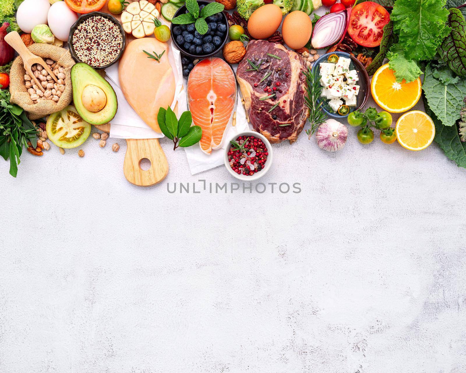 Ketogenic low carbs diet concept. Ingredients for healthy foods selection set up on white concrete background.