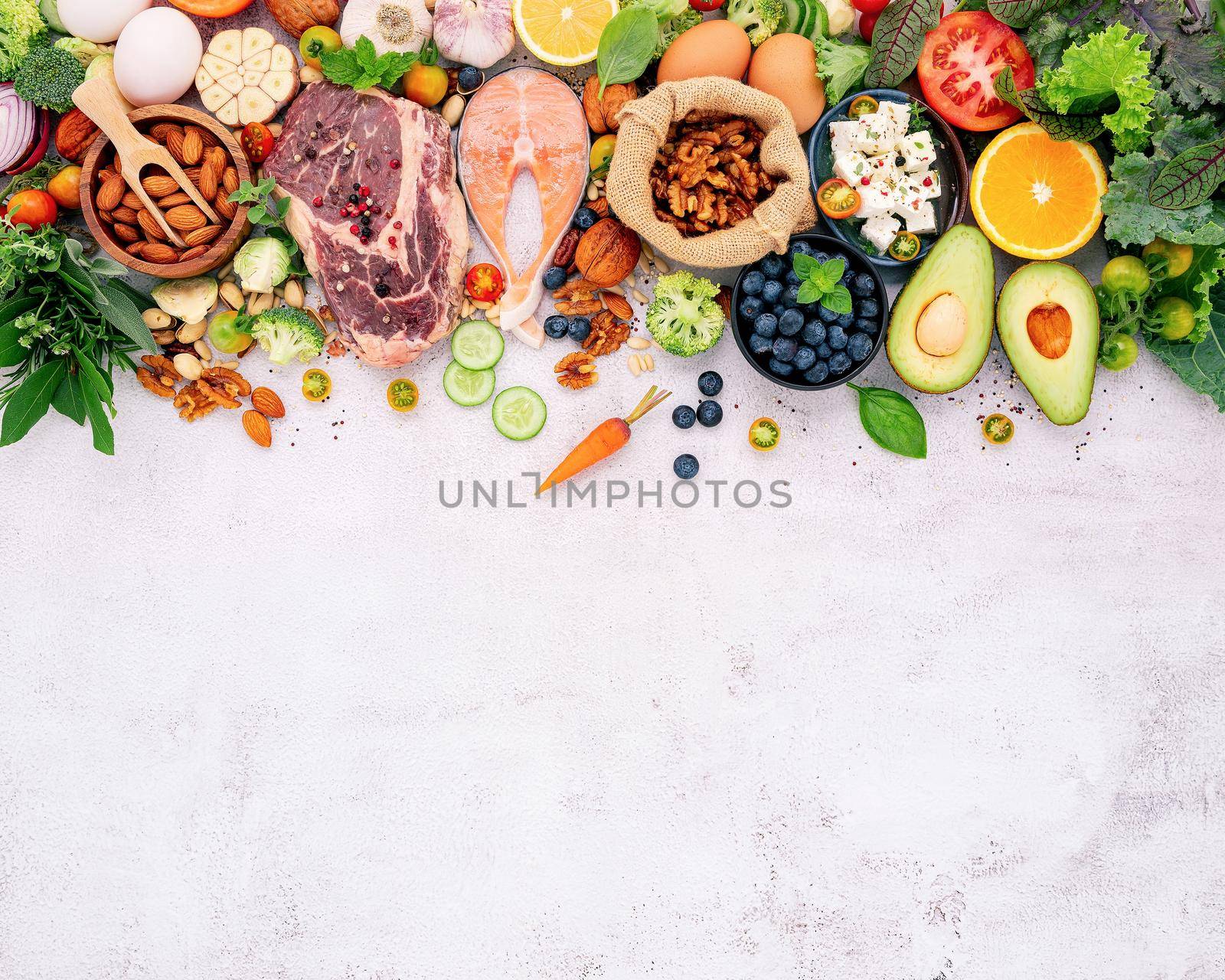 Ketogenic low carbs diet concept. Ingredients for healthy foods selection set up on white concrete background. by kerdkanno