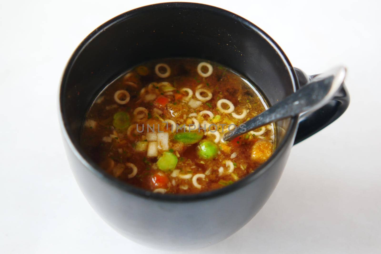 instant cup soup in a mug on table .