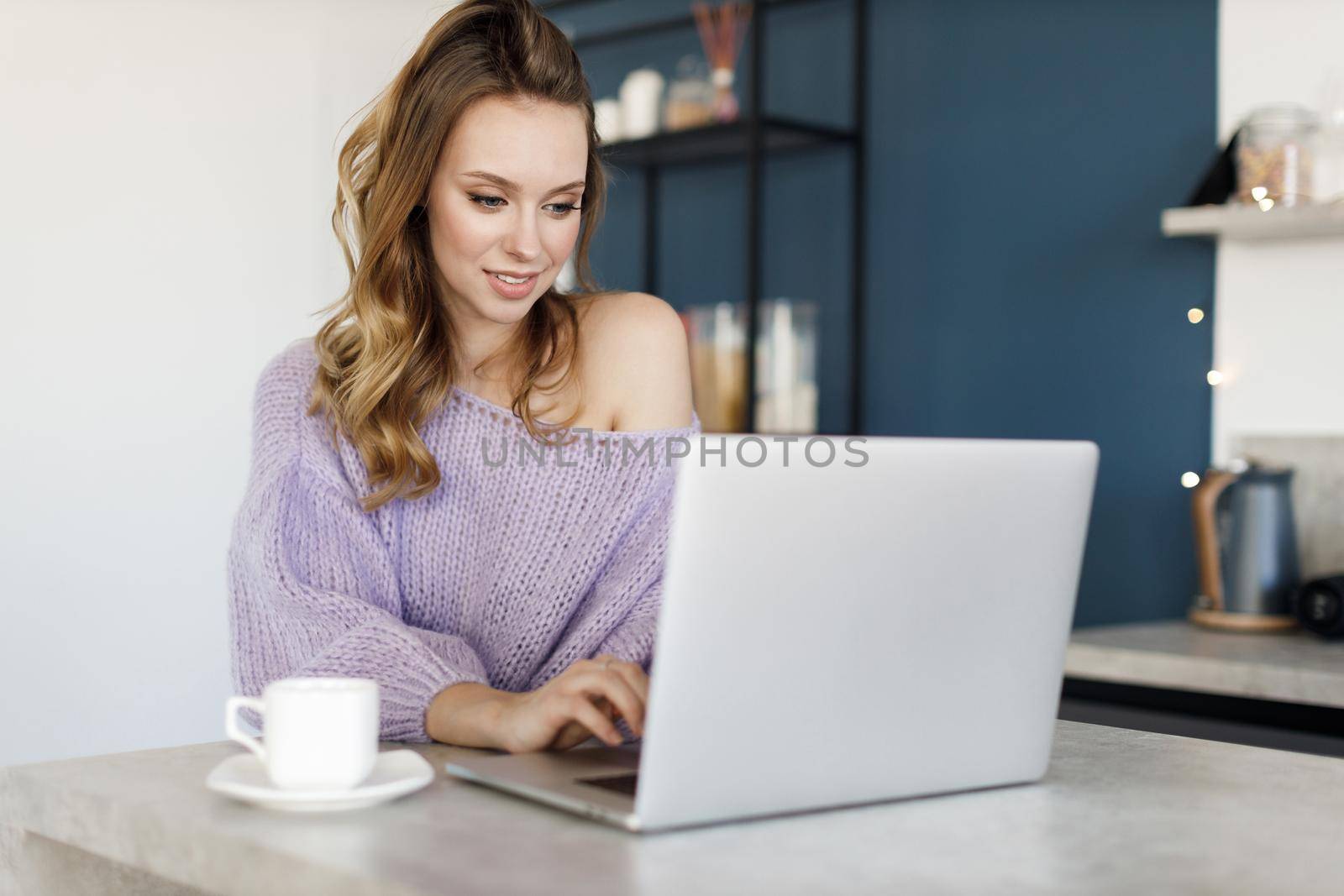 Young woman working at home, cozy portrait indoor. High quality photo