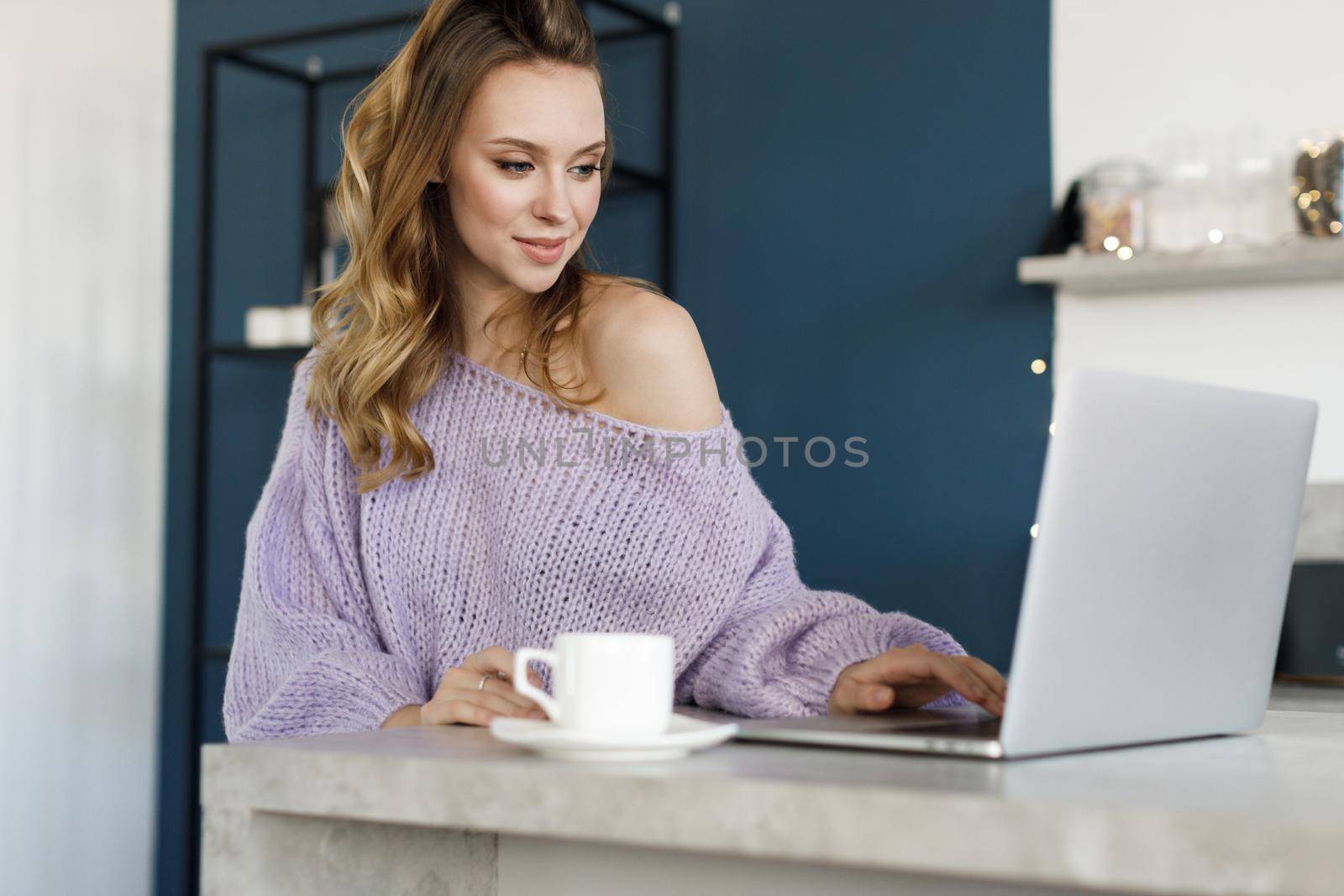 Young woman working at home, cozy portrait indoor. High quality photo