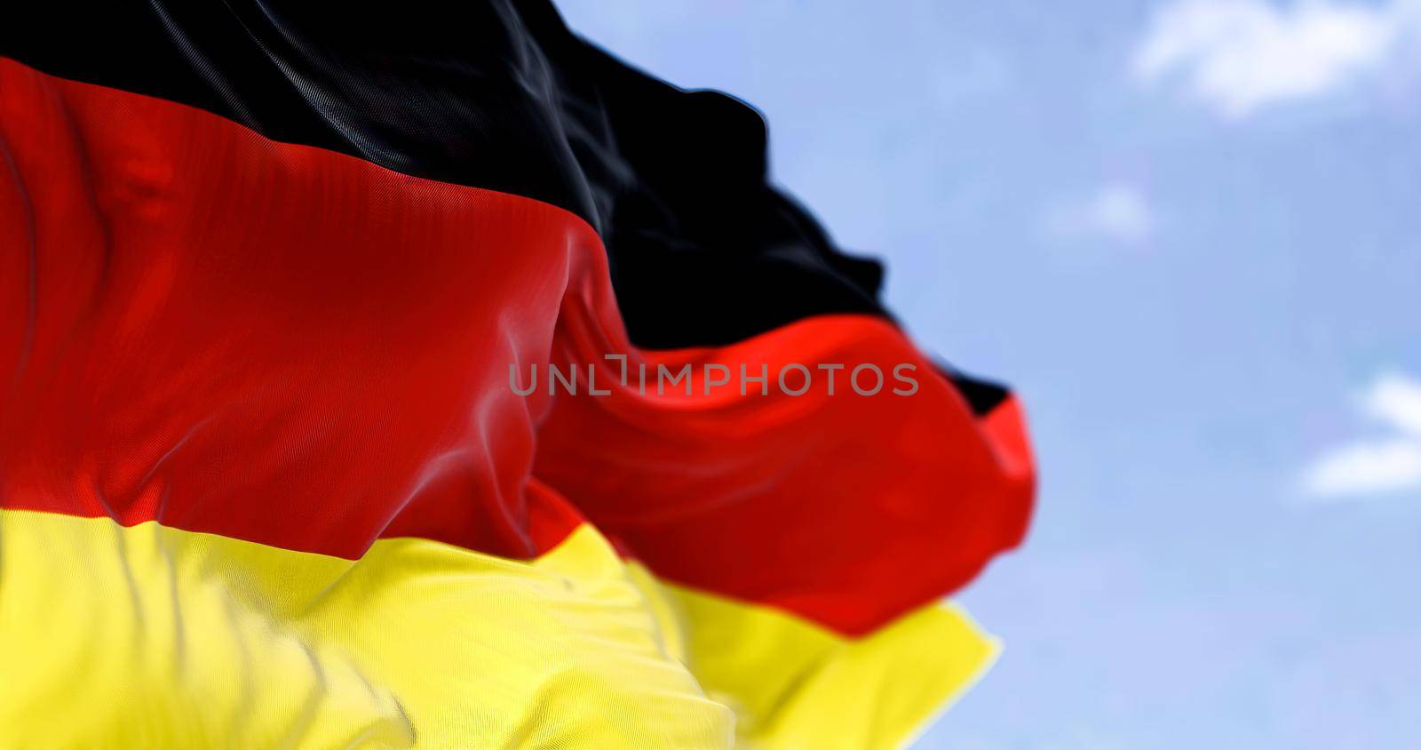 Detail of the national flag of Germany flying in the wind by rarrarorro