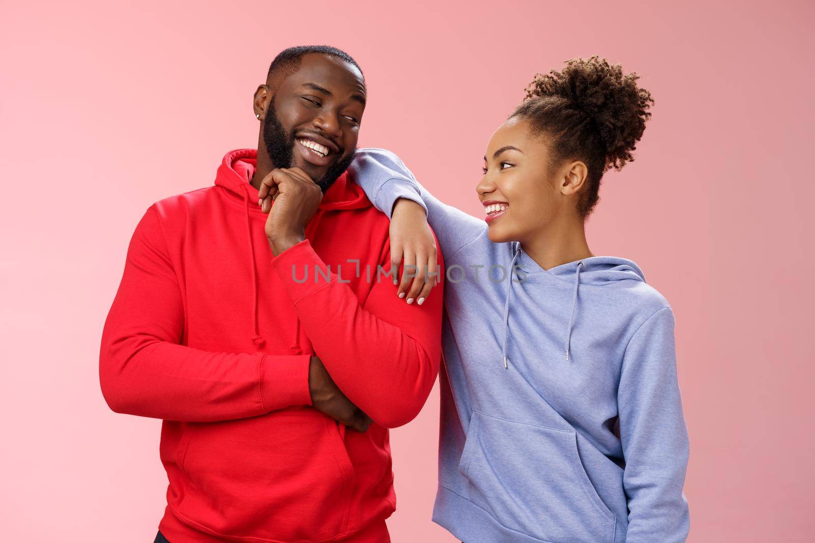 Two best friends having fun man smiling woman leaning his shoulder talking laughing joking like spending time together, standing pink background chit-chat confident relaxed poses by Benzoix