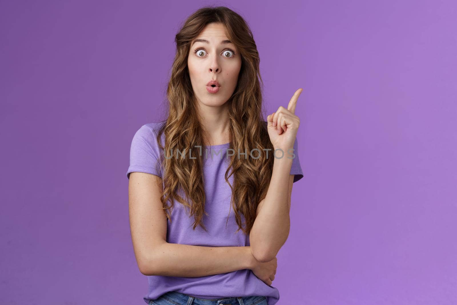 Got it eureka. Excited enthusiastic creative cute european girl raise index finger folding lips wow great found solution suggest perfect plan stand purple background thrilled give good advice by Benzoix