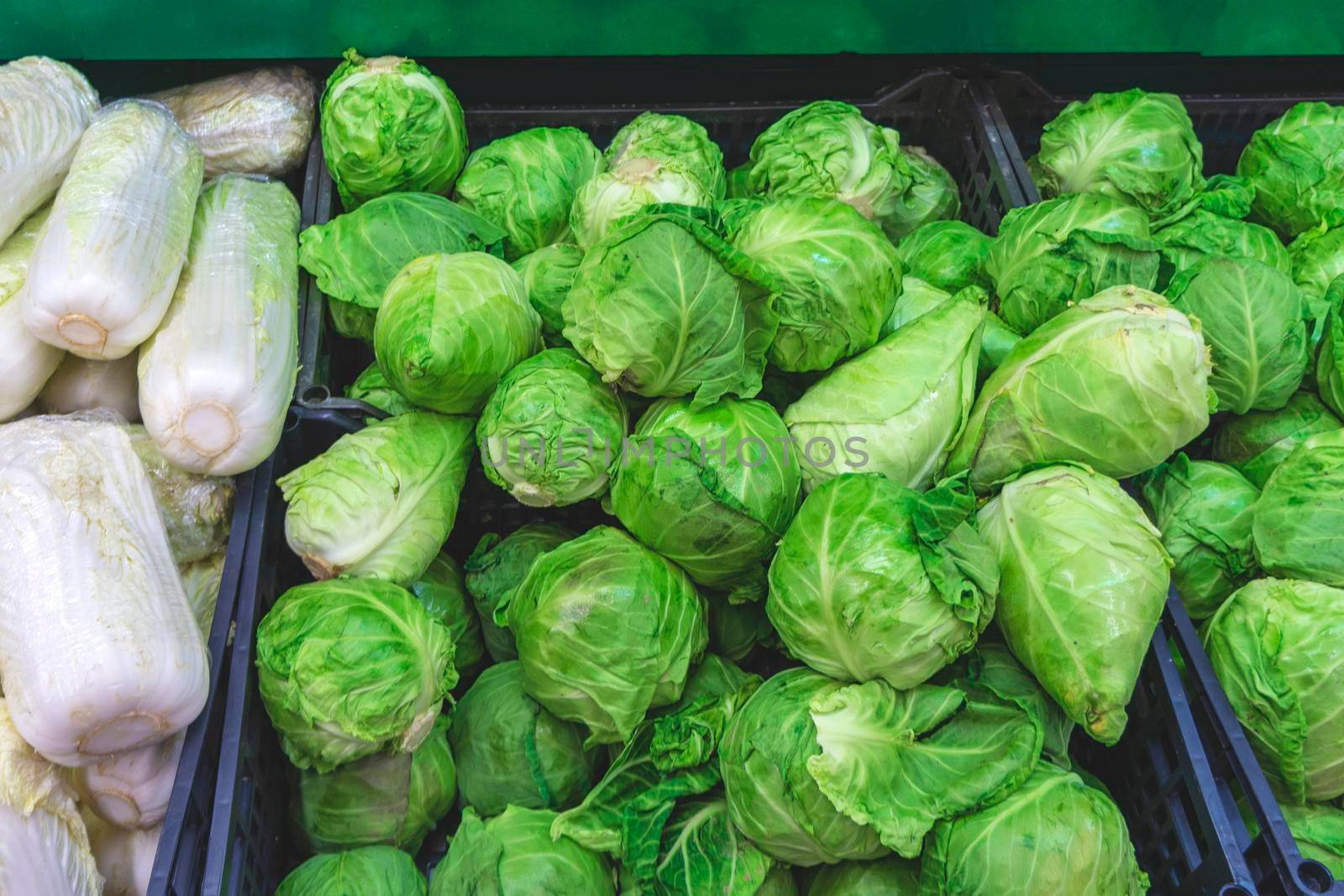 Pile of cabbage in boxes. cabbage in supermarket.  concept purchase of cabbage by BALKON