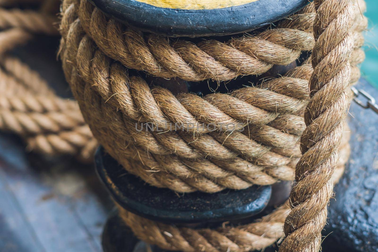 A thick rope on a ship, a ferry for tethering.