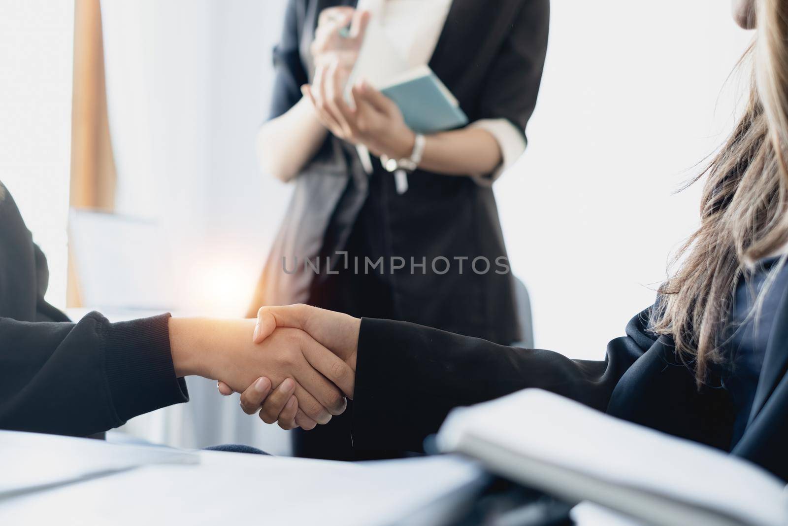 Business people shaking hands to celebration partnership and business deal, Team Working together for next year concept. by itchaznong