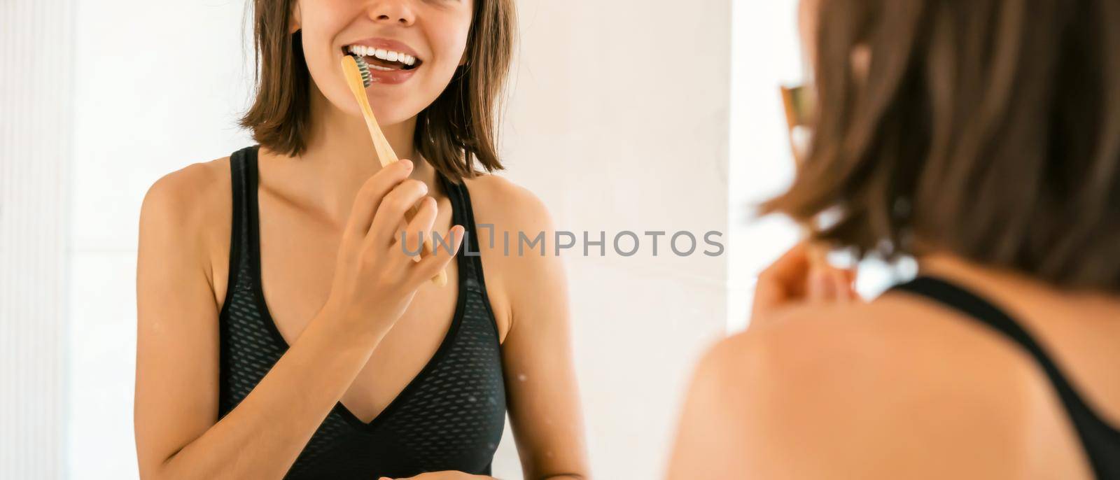 Young girl is cleaning her teeth. by africapink