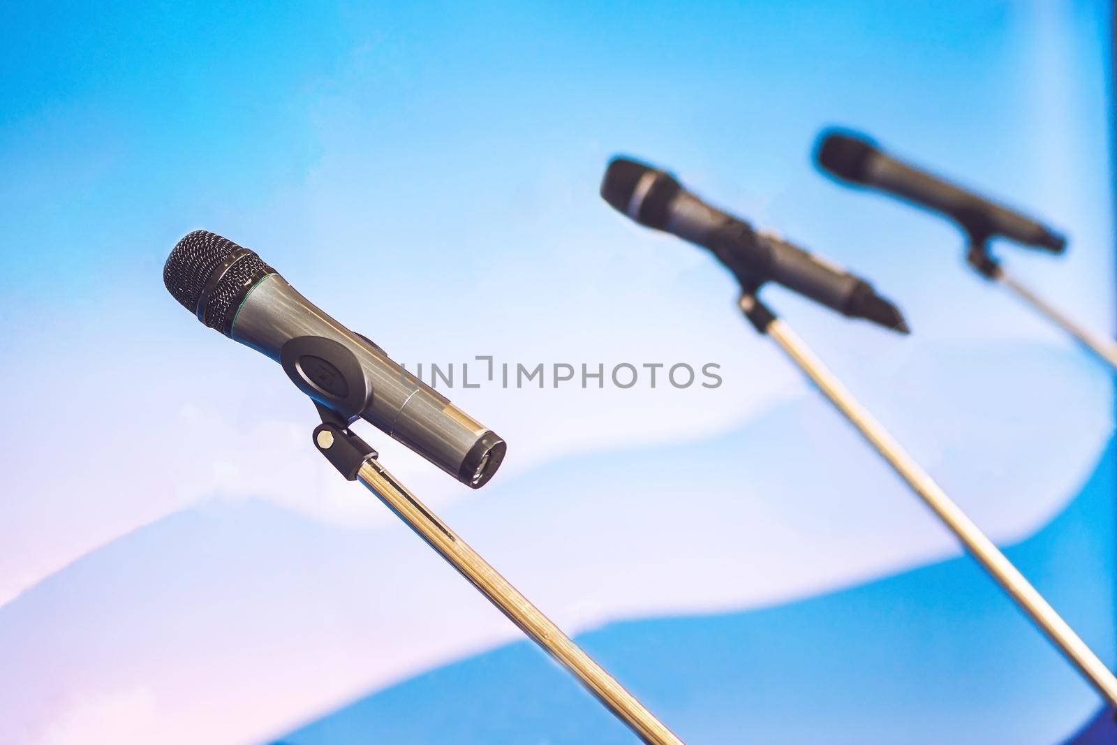 Microphone voice speaker with audiences or students in seminar classroom, lecture hall or conference meeting in educational business event for host, teacher, or coaching mentor by galitskaya