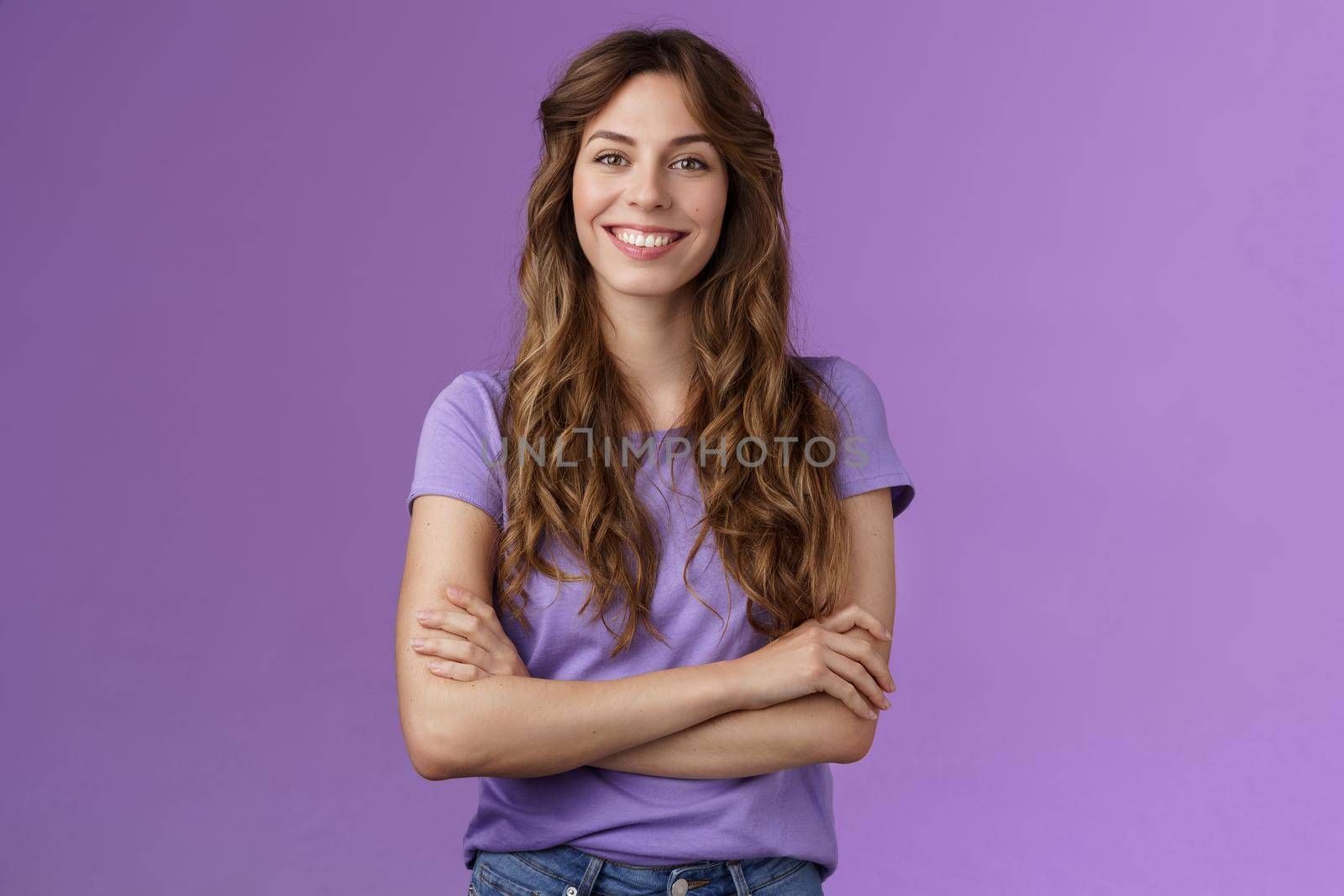 Confident professional skillful female photographer freelancer ready photo competition cross hands chest motivated assertive pose smiling broadly confident own abilities stand purple background.
