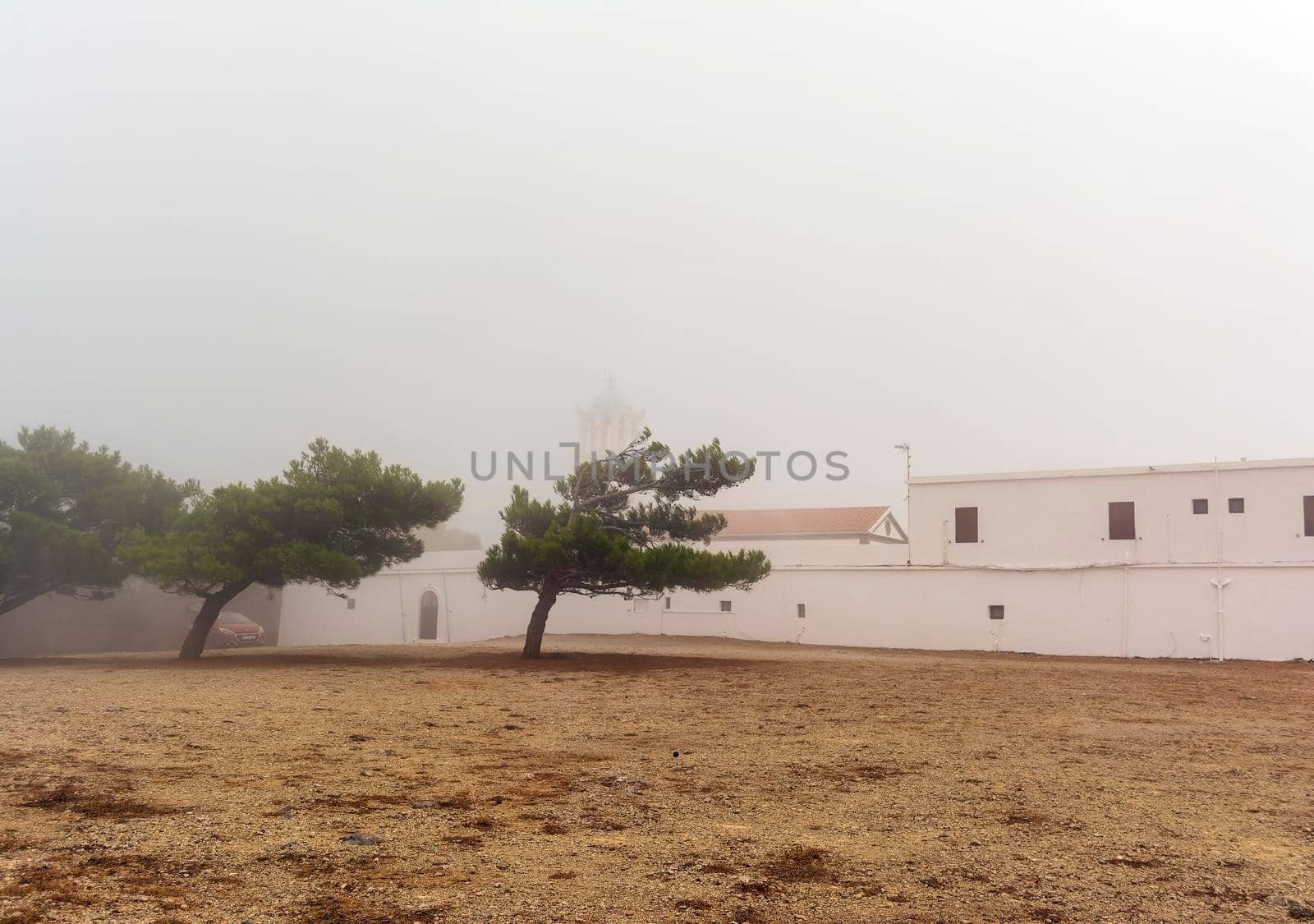 View of the famous old monastery of Agia Elesa in fog. Kythira island, Greece. by ankarb