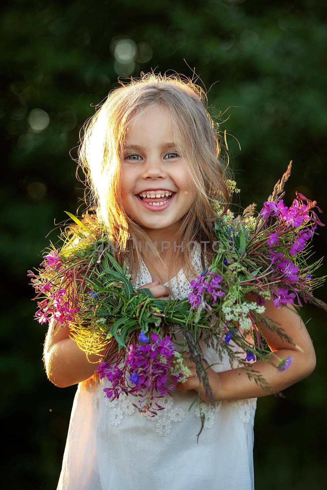 beautiful little girl in a wreath. High quality photo