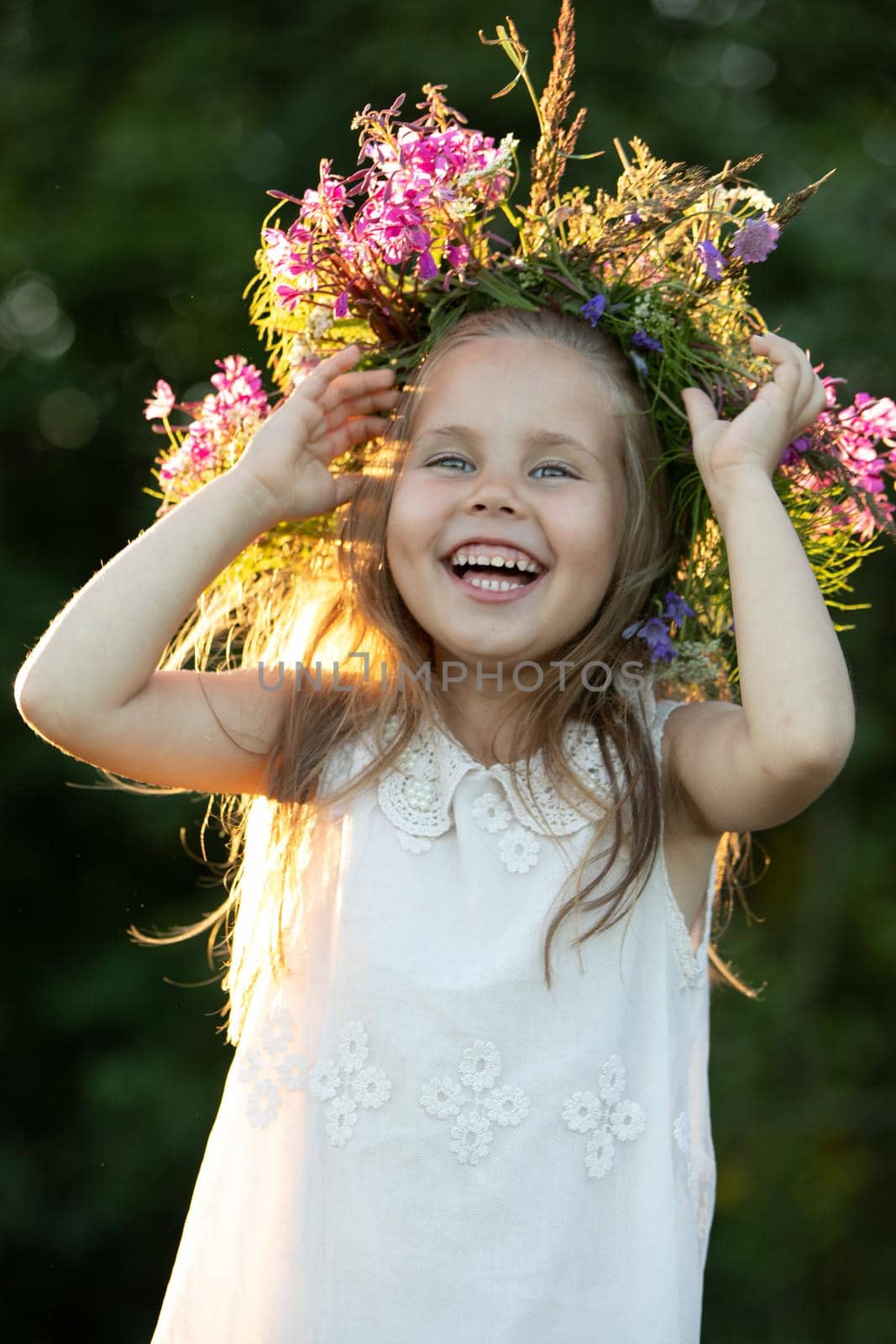 beautiful little girl in a wreath. High quality photo
