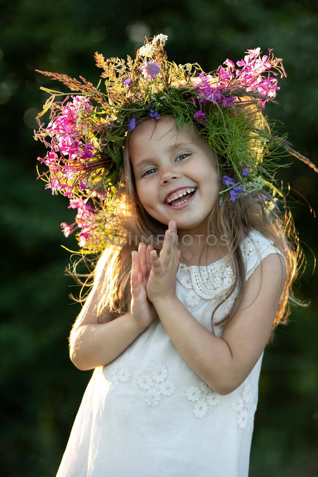 beautiful little girl in a wreath. High quality photo