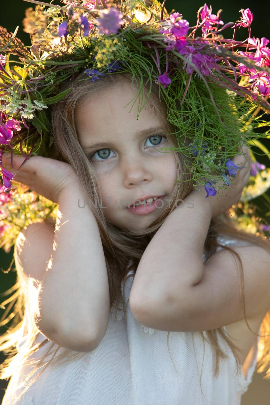 beautiful little girl in a wreath. High quality photo