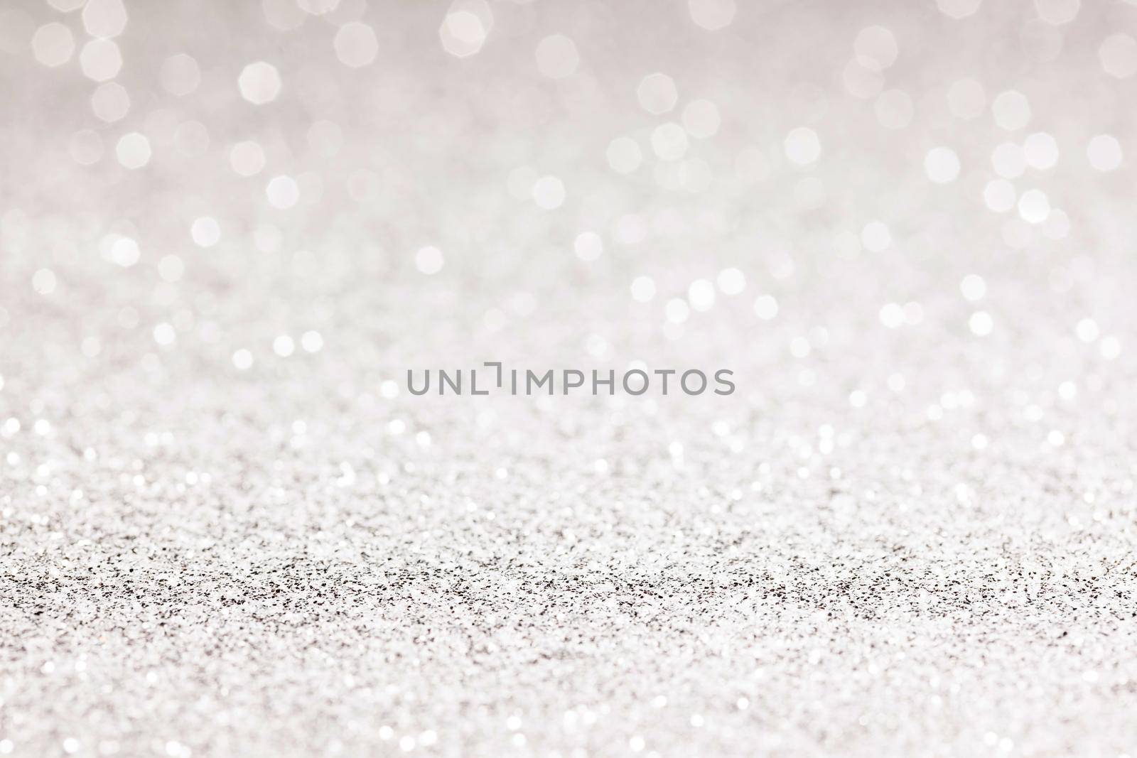 sparkles of Silver glitter abstract background. Copy space.