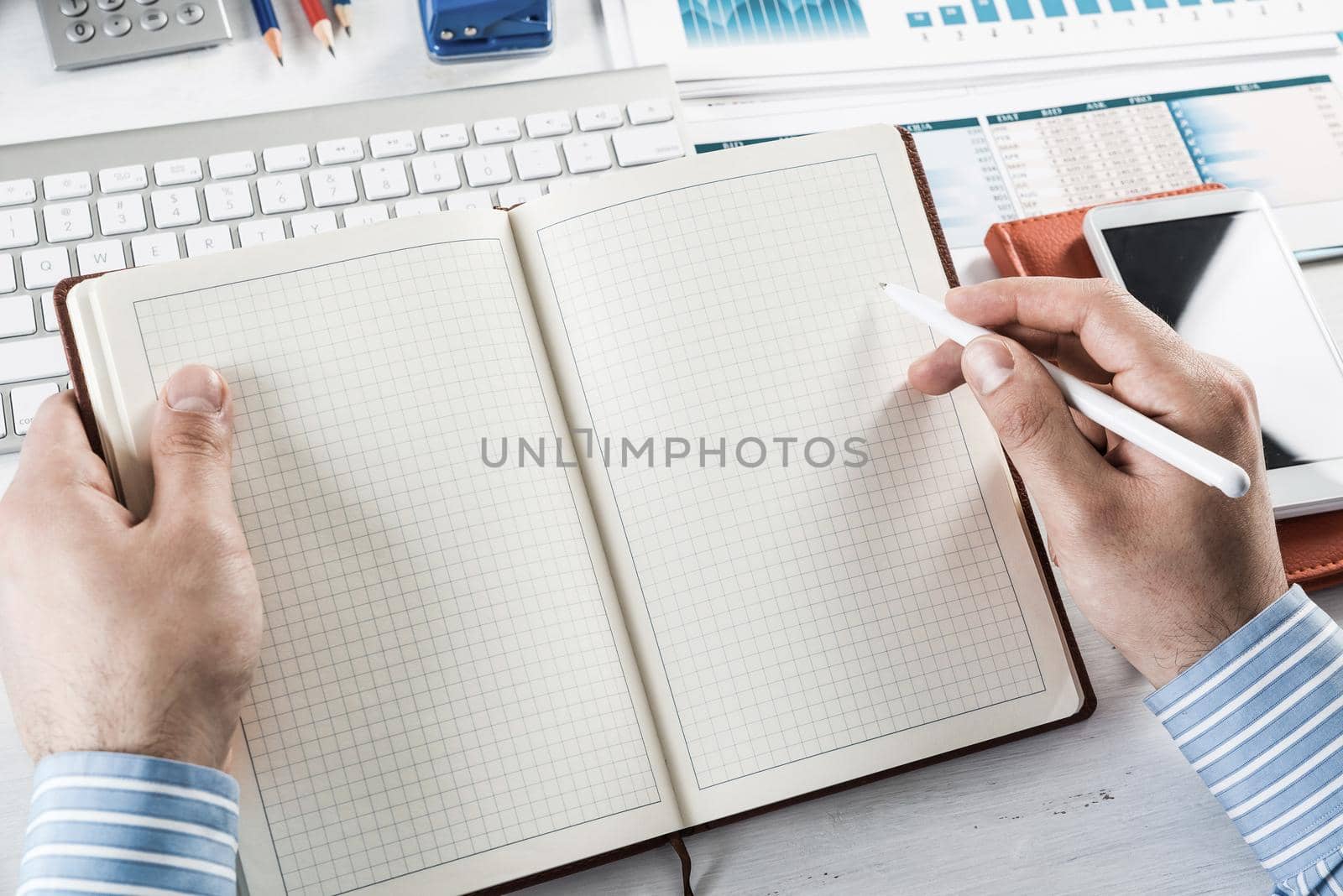 close-up of hands with notepad. office work