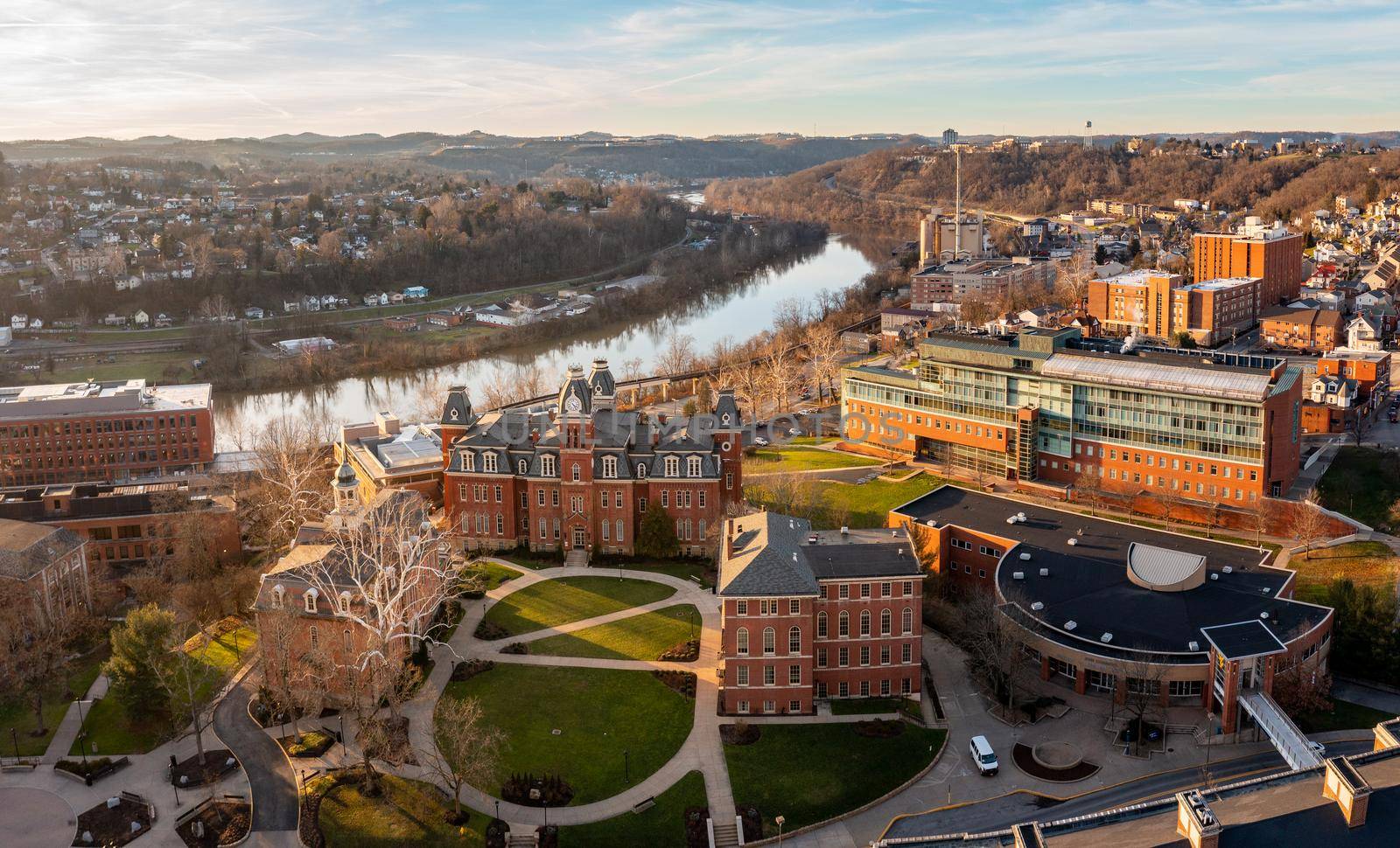 Aerial drone panoramic shot of the downtown campus of WVU in Morgantown West Virginia showing the river in the distance